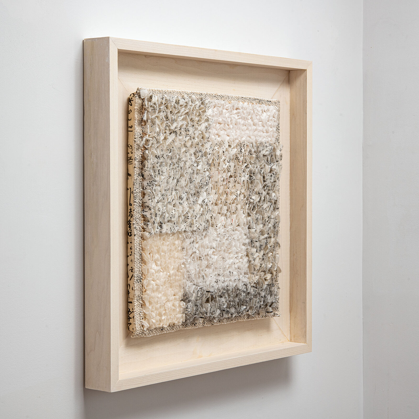 A picture of a piece of art hanging on a wall.