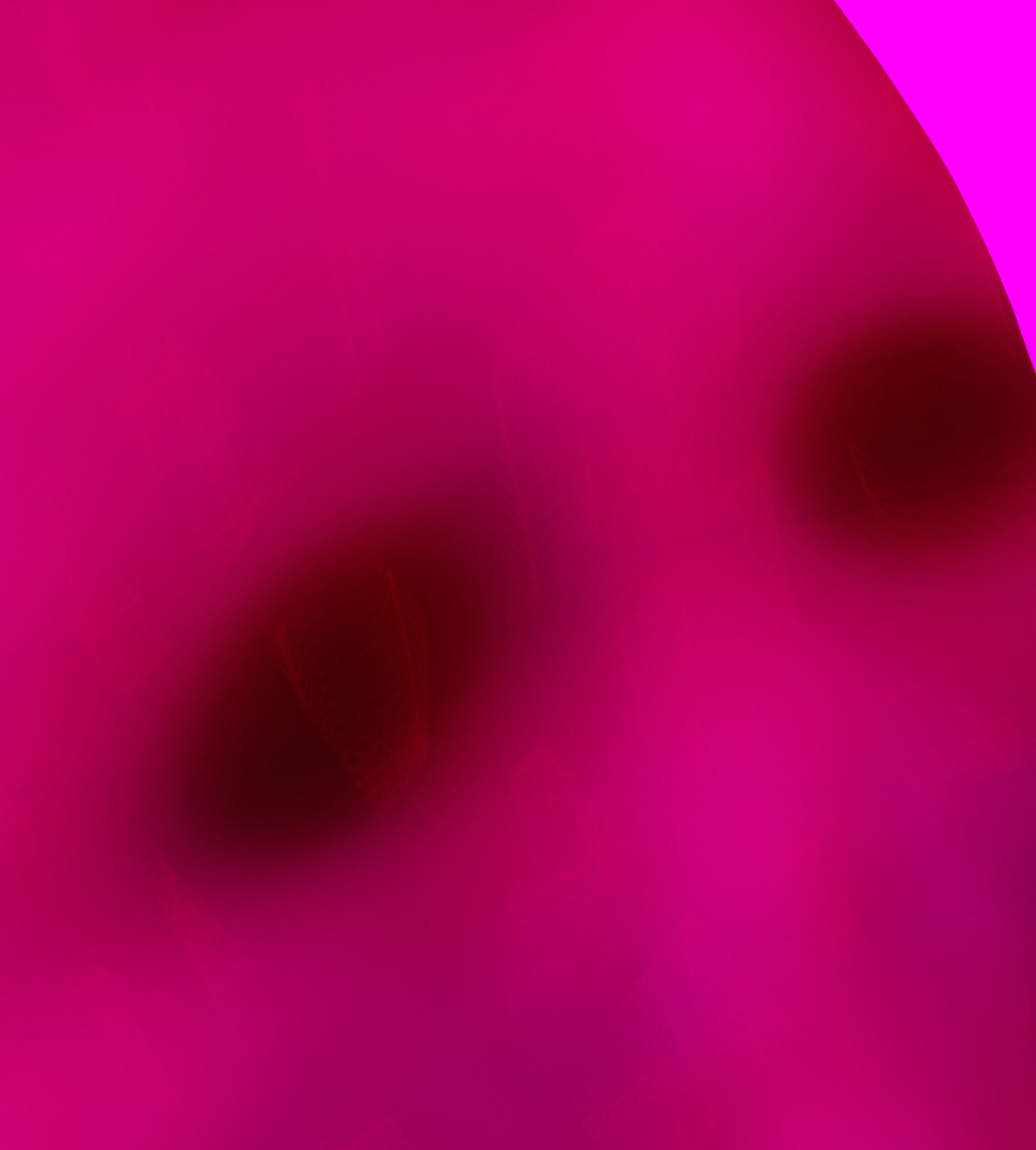 A pink background with a red circle in the middle.