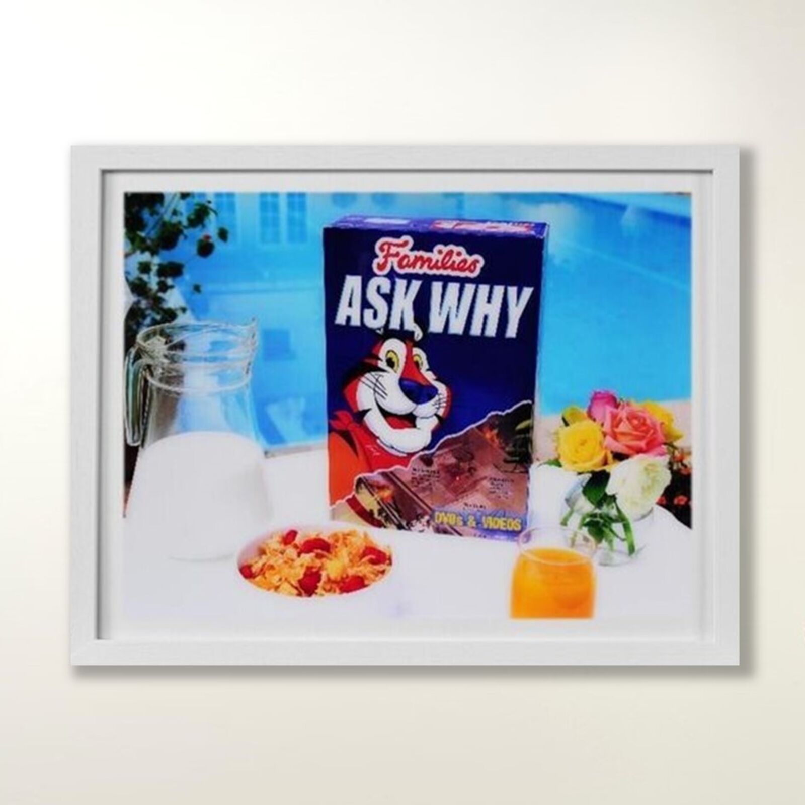 A picture of a box of cereal and a glass of milk.