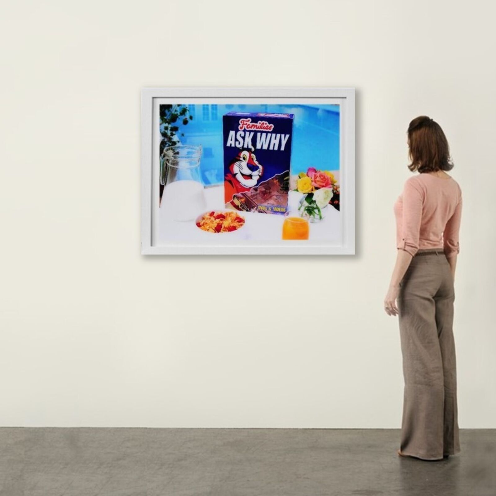 A picture of a box of cereal and a glass of milk.