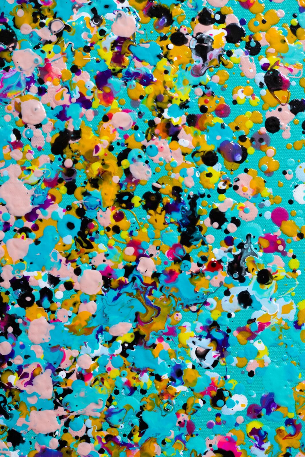 A painting of colorful confetti on a blue background.