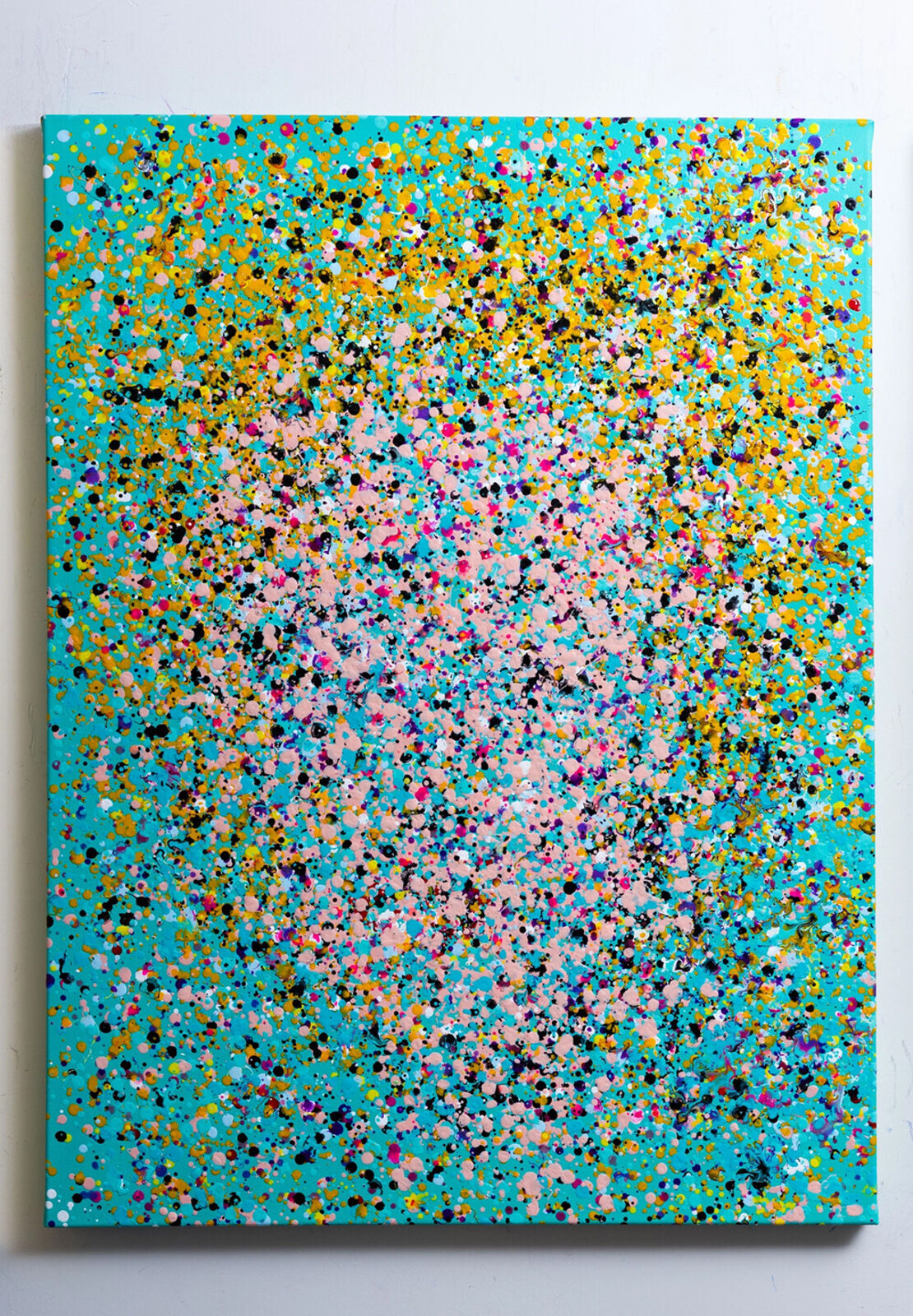 A painting of colorful confetti on a blue background.