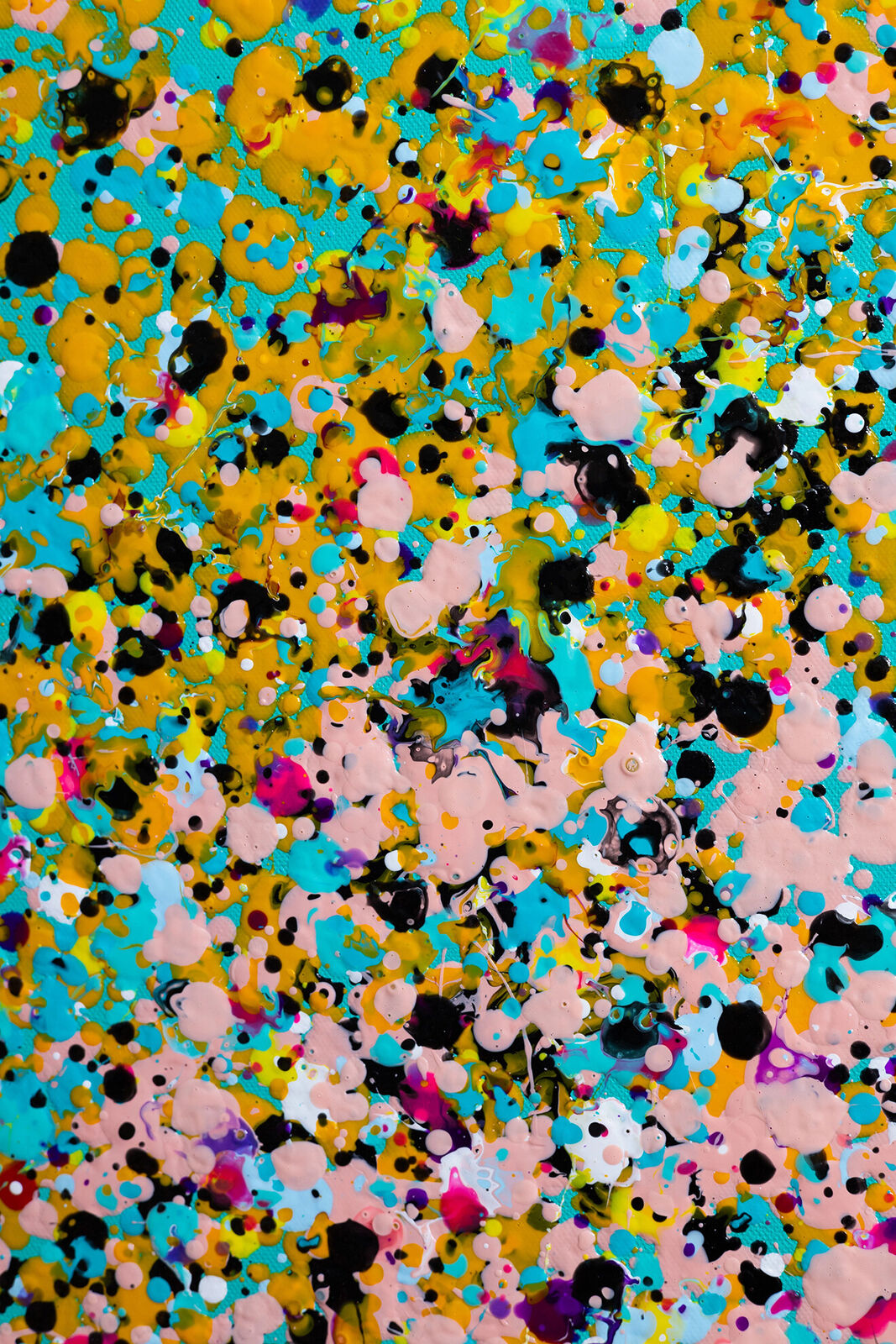 A painting of colorful confetti on a blue background.