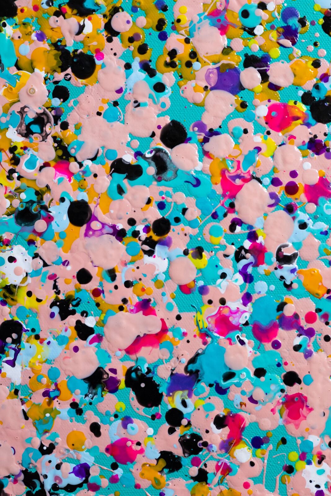 A painting of colorful confetti on a blue background.
