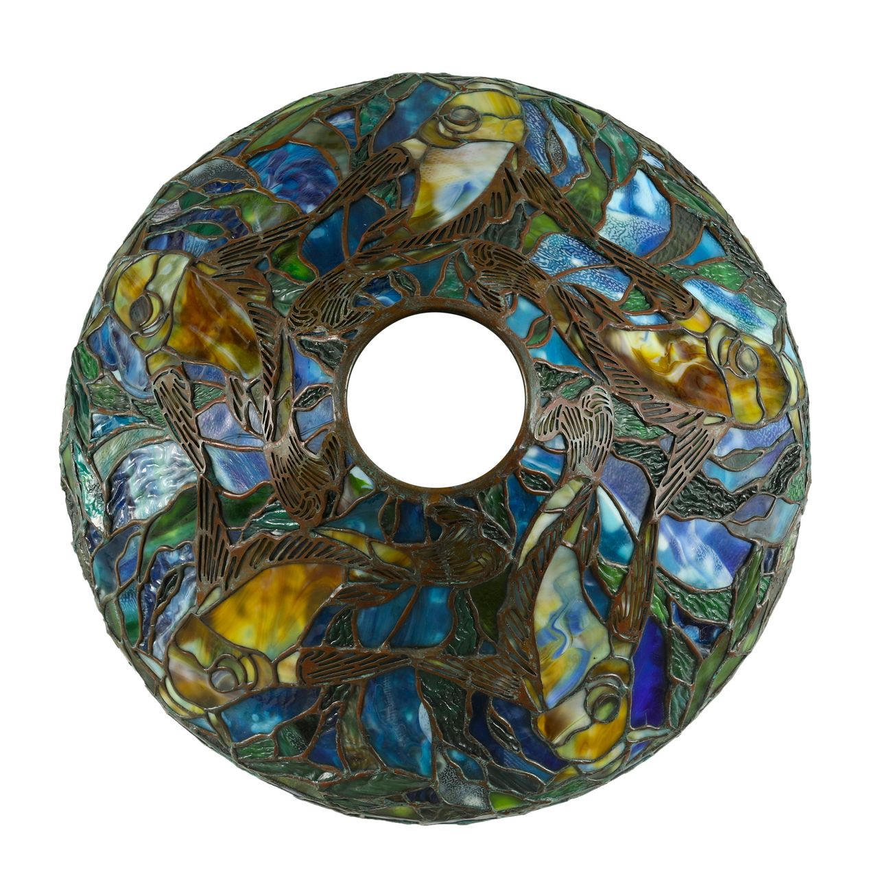 A stained-glass table lamp featuring a vibrant underwater scene with fish and aquatic plants.