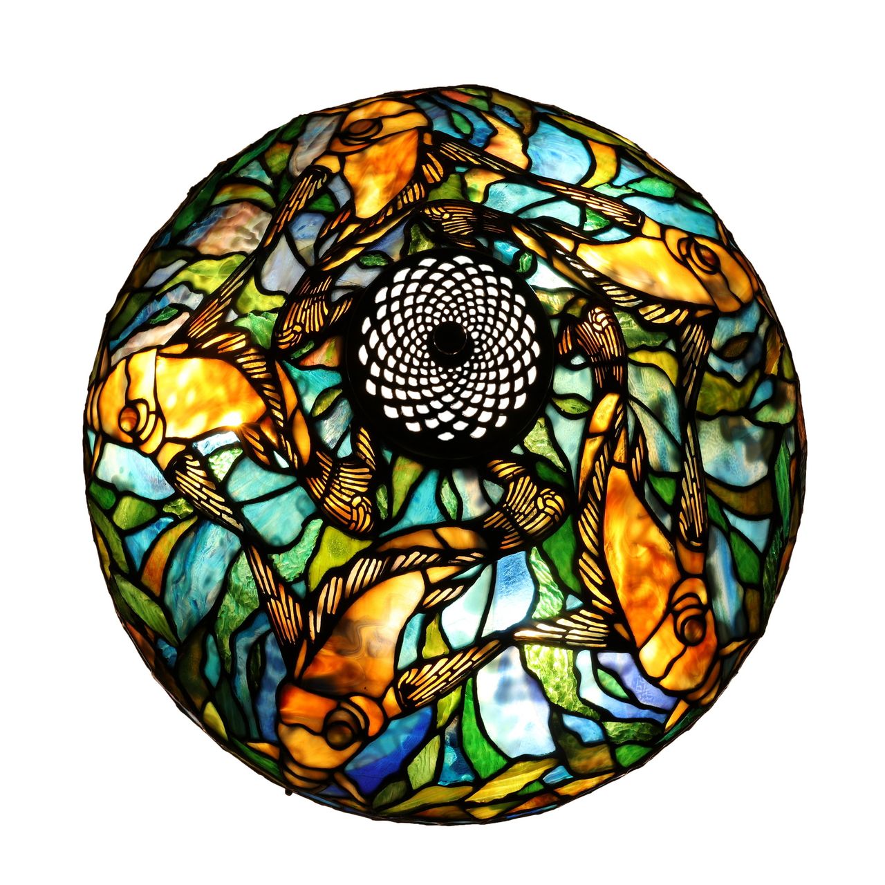 A stained-glass table lamp featuring a vibrant underwater scene with fish and aquatic plants.