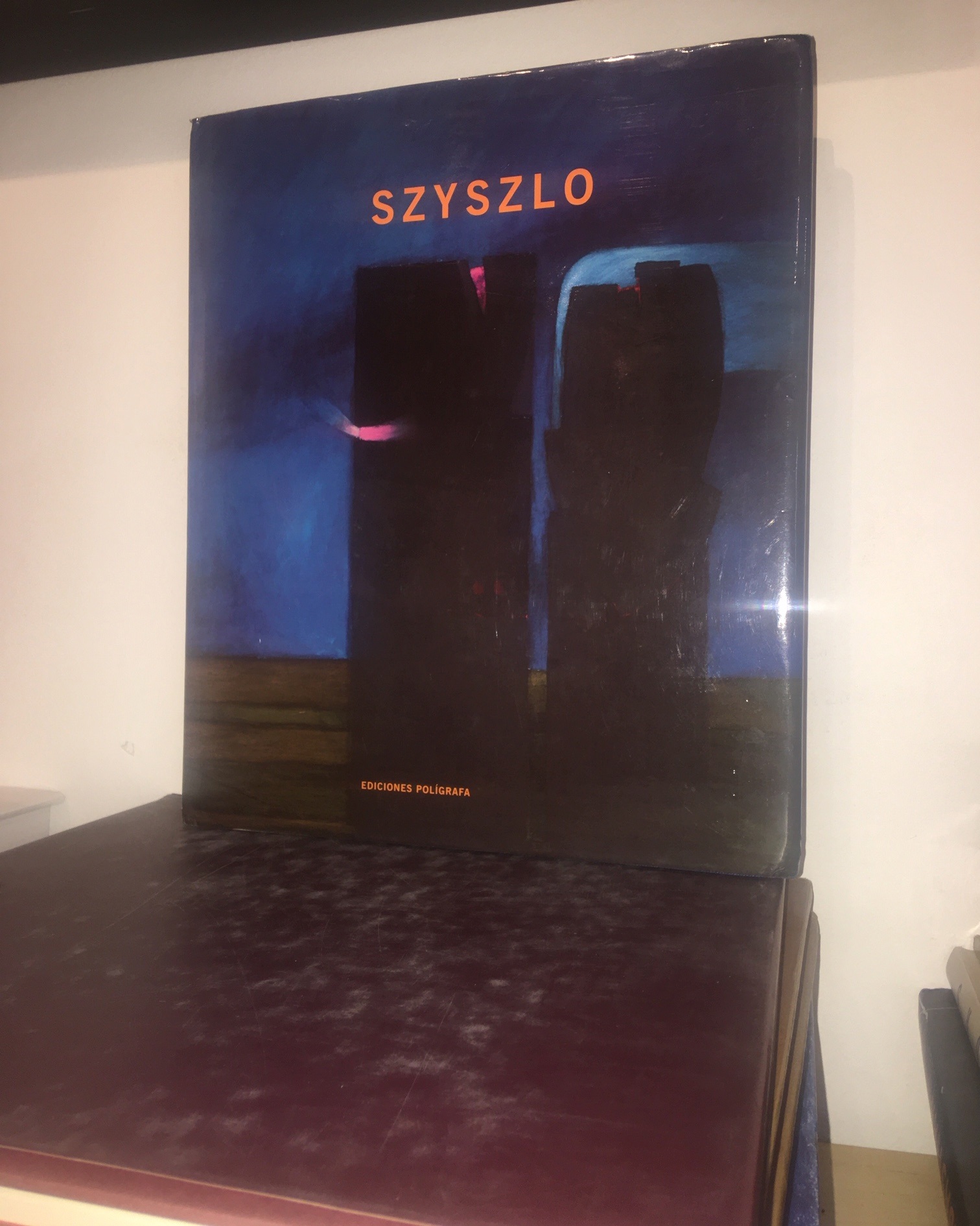 A book sitting on top of a wooden table.
