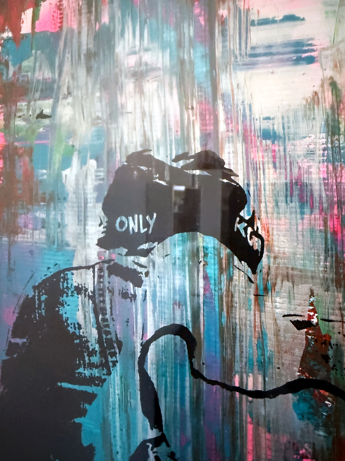 A picture of a painting hanging on a wall in a room.