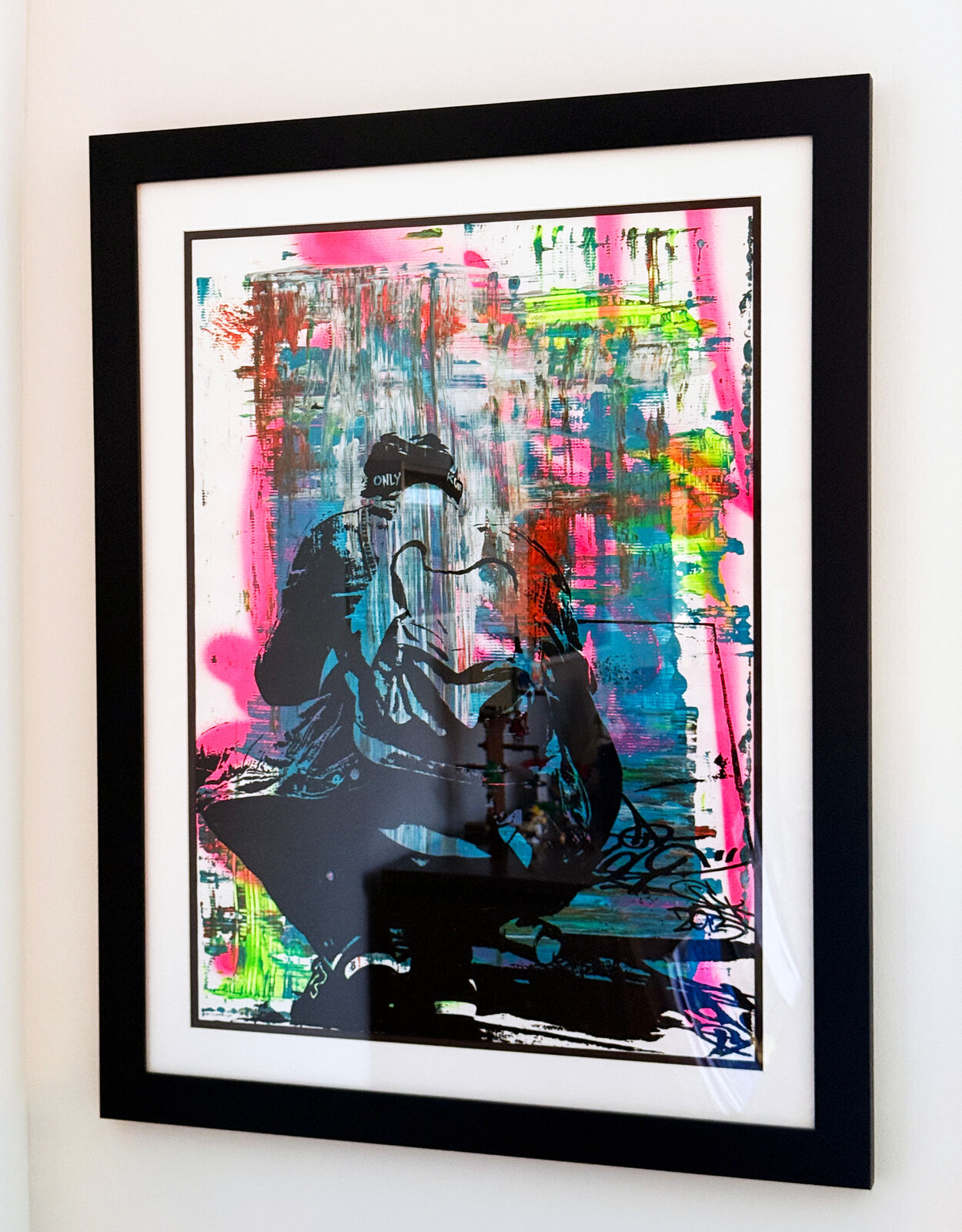 A picture of a painting hanging on a wall in a room.