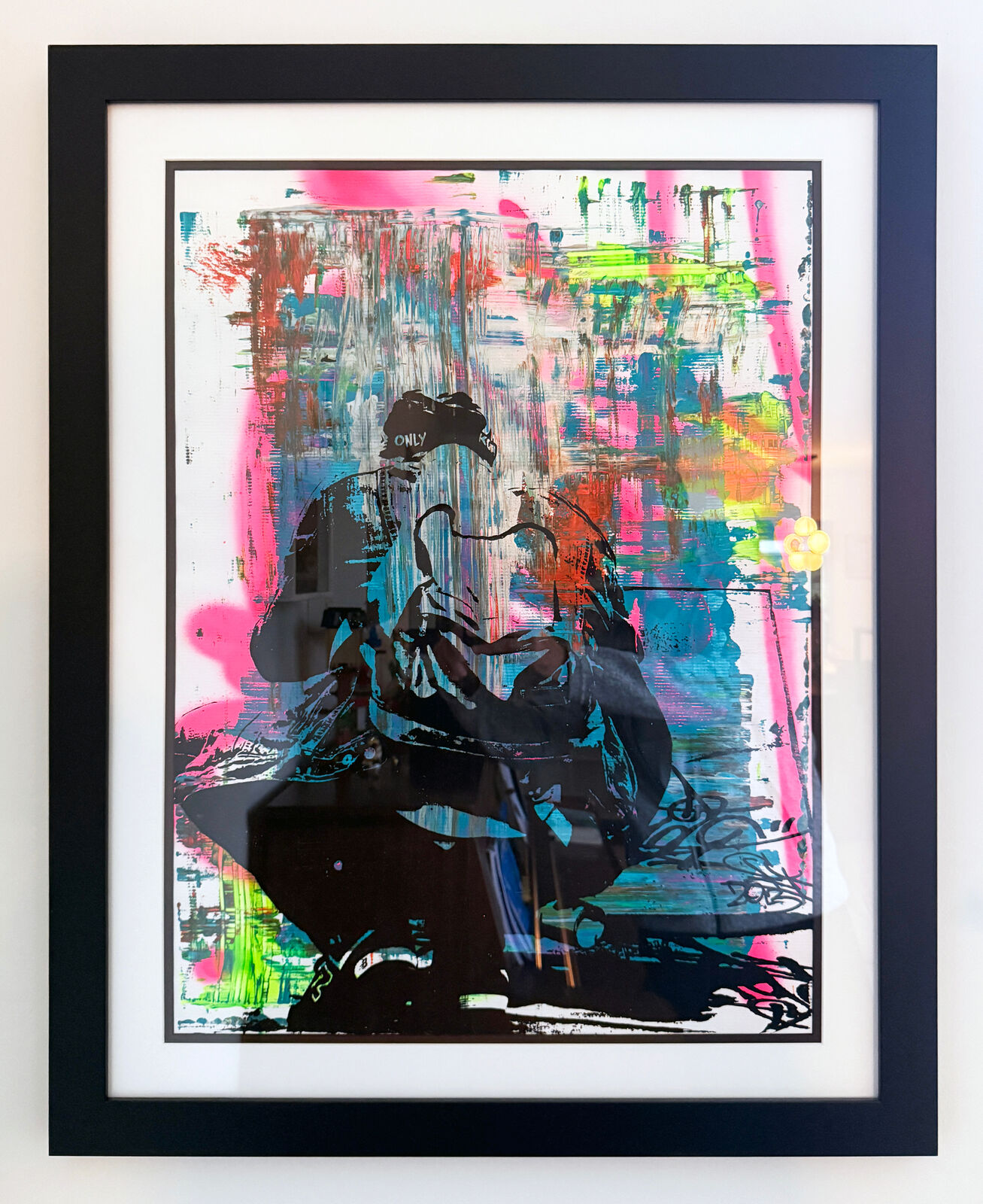 A picture of a painting hanging on a wall in a room.