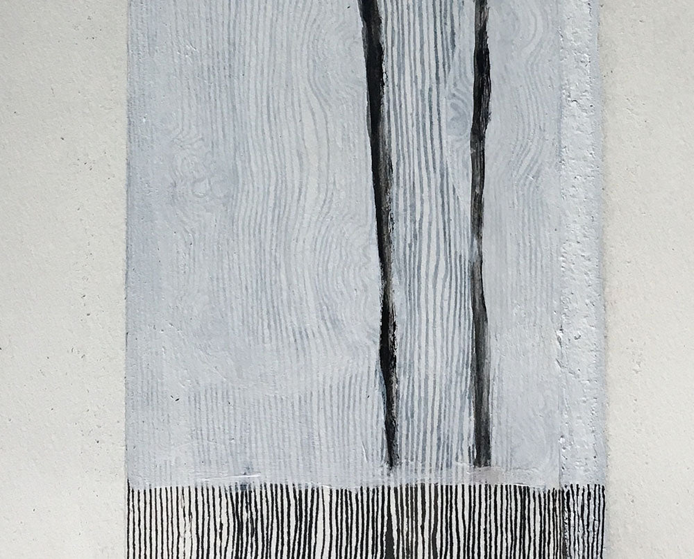 A piece of paper with a black and white drawing on it.