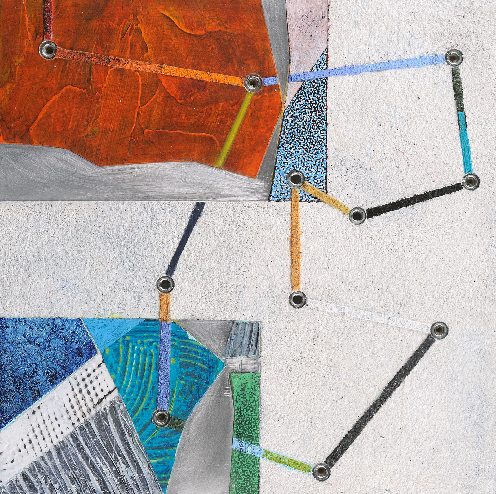 A close up of a piece of art on a wall.