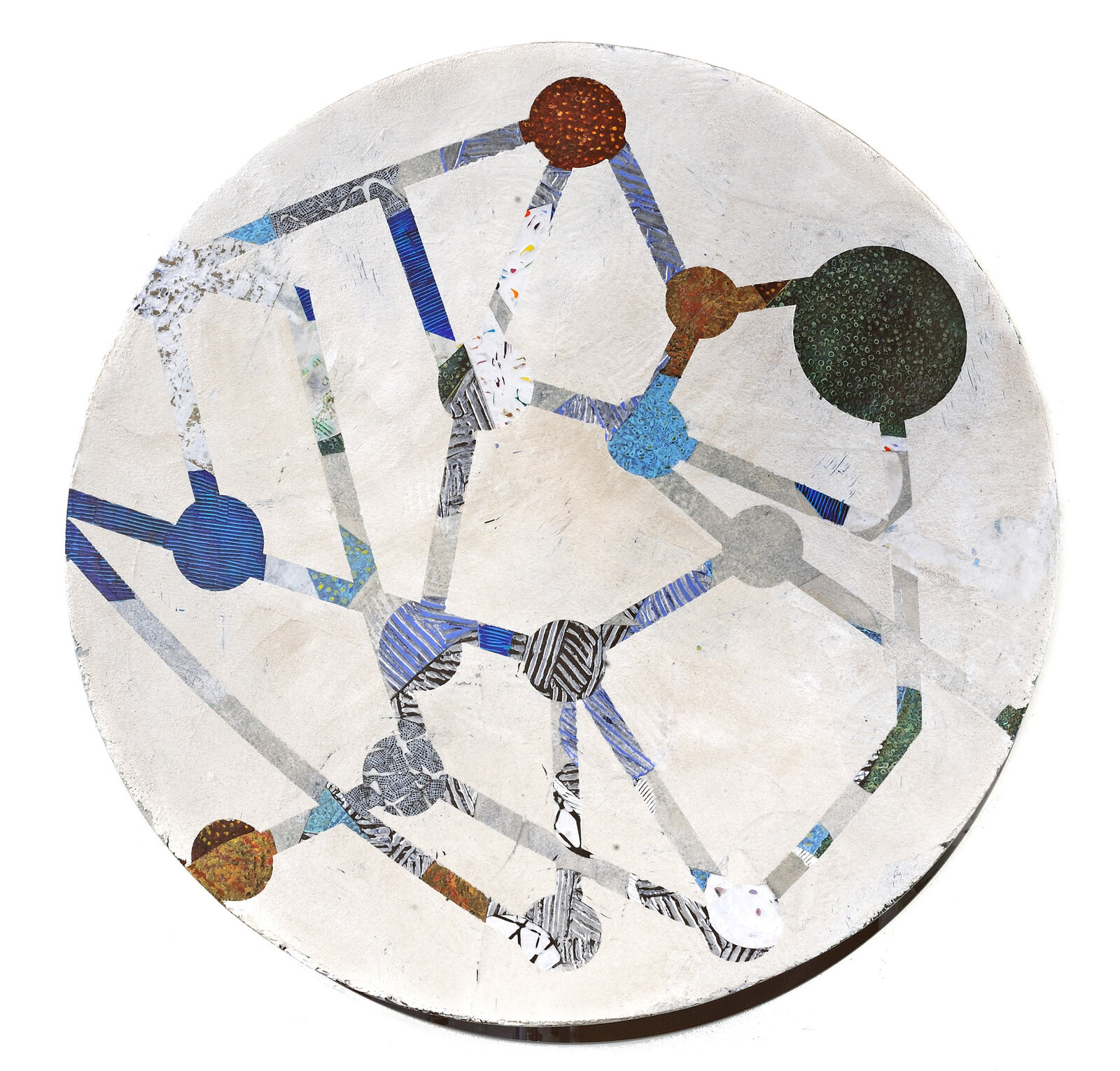 A circular piece of art that is on a white surface.
