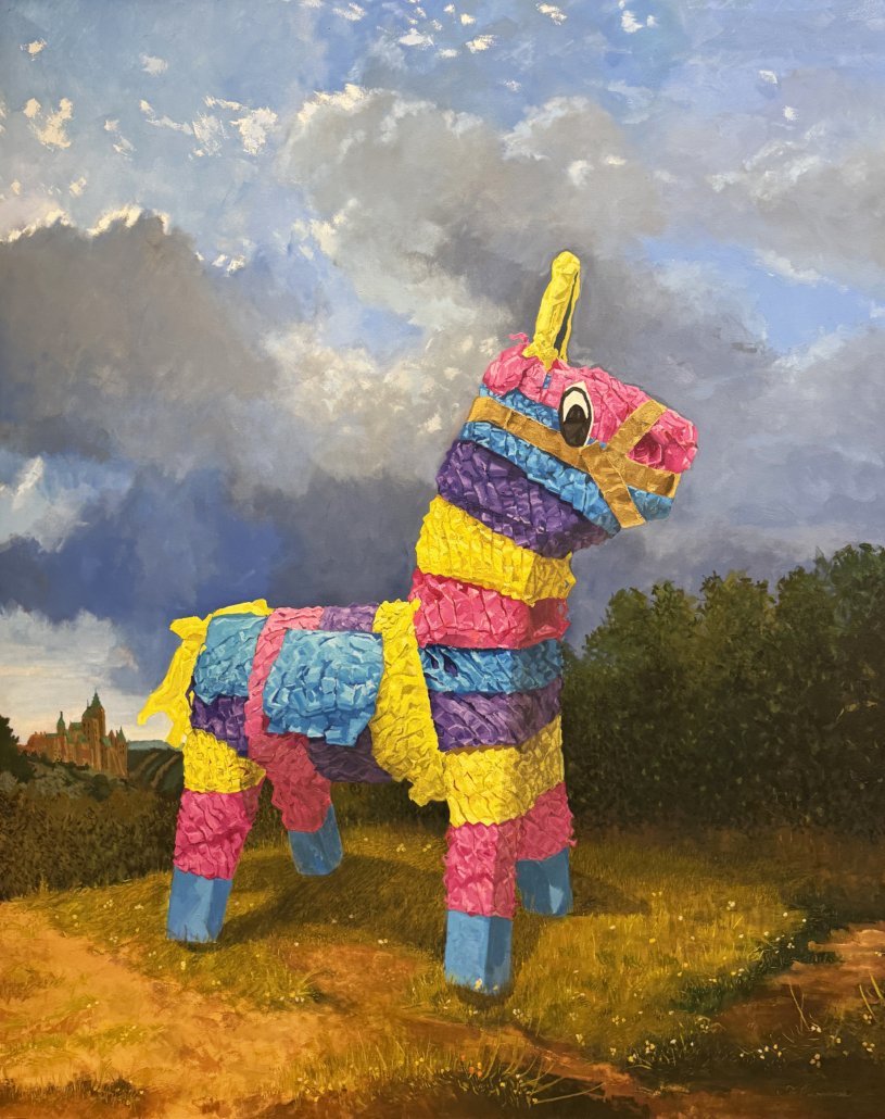 A colorful pinata in the middle of a field.