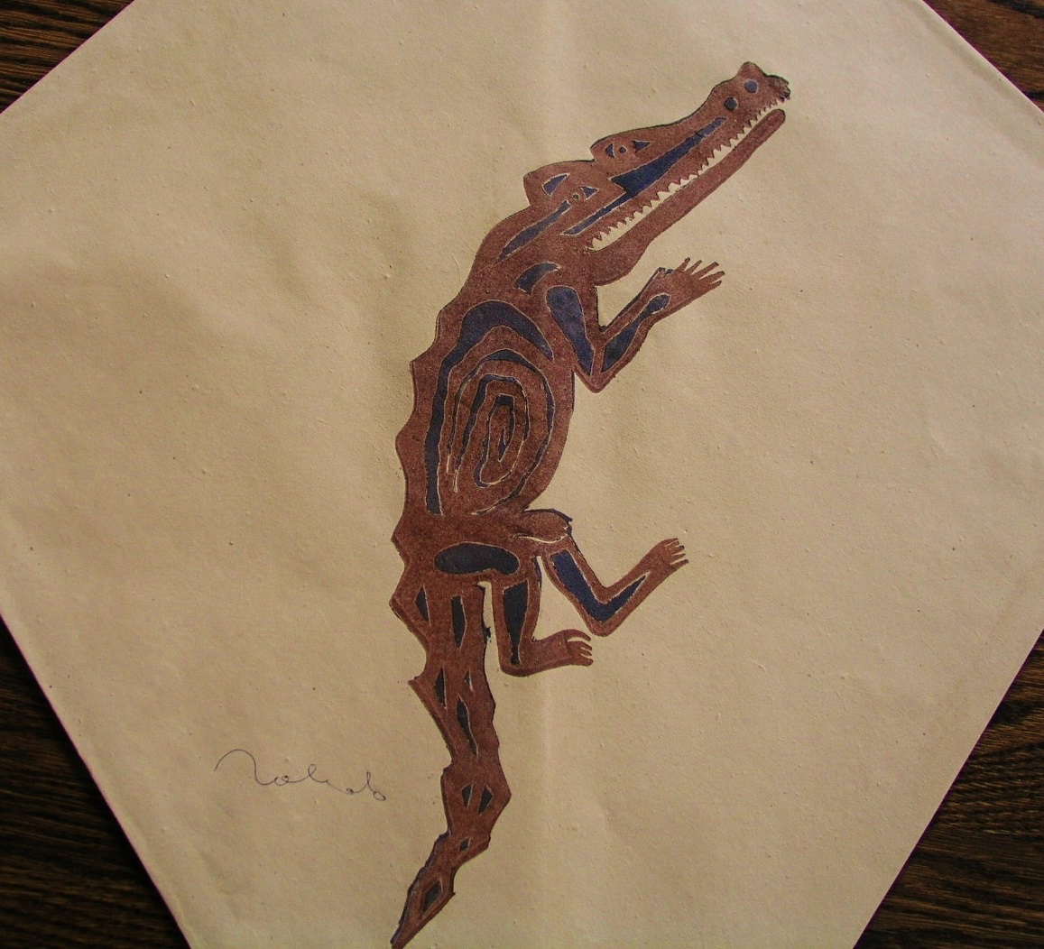 A drawing of a crocodile on a piece of paper.