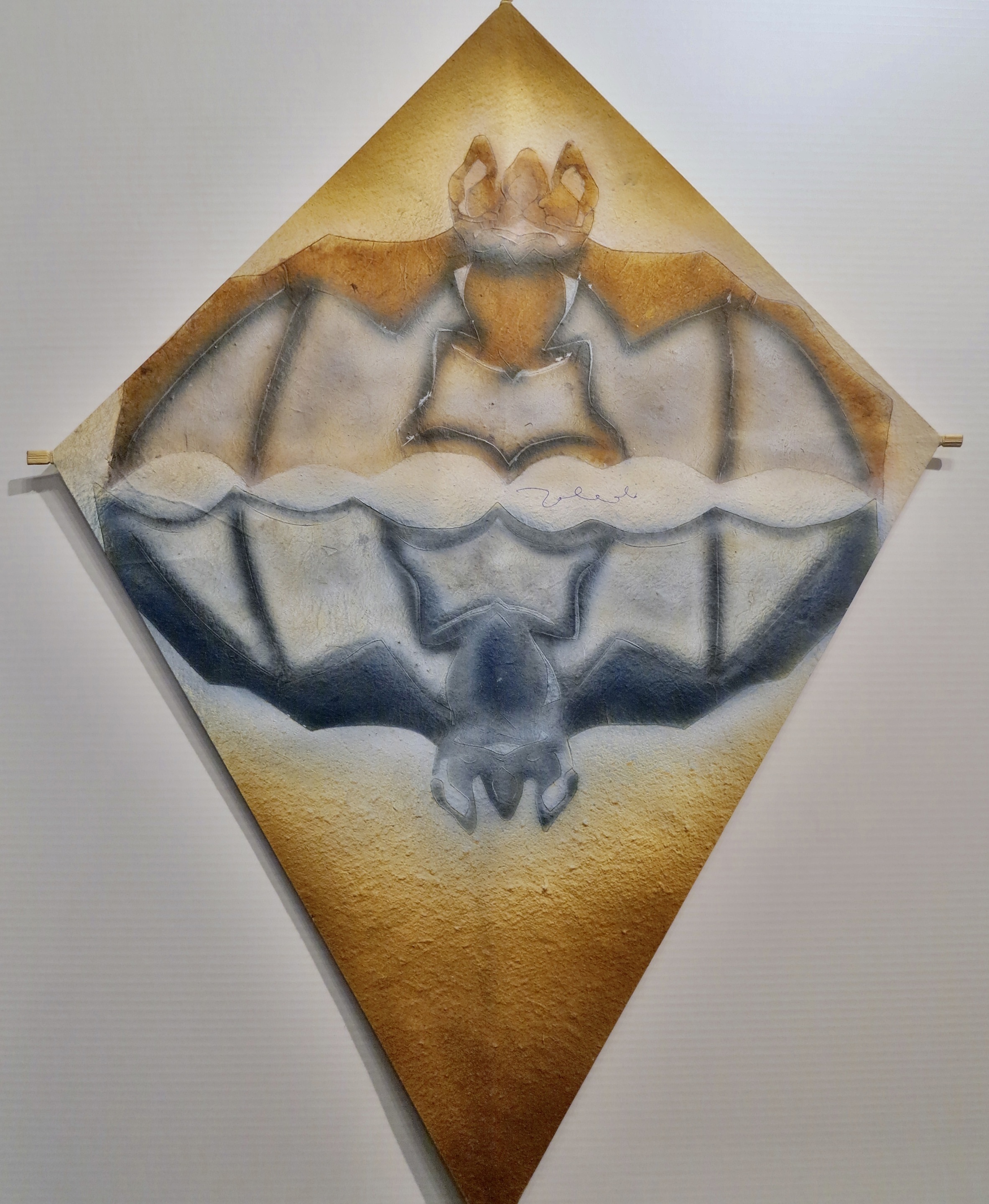 A drawing of a bat on a piece of paper.