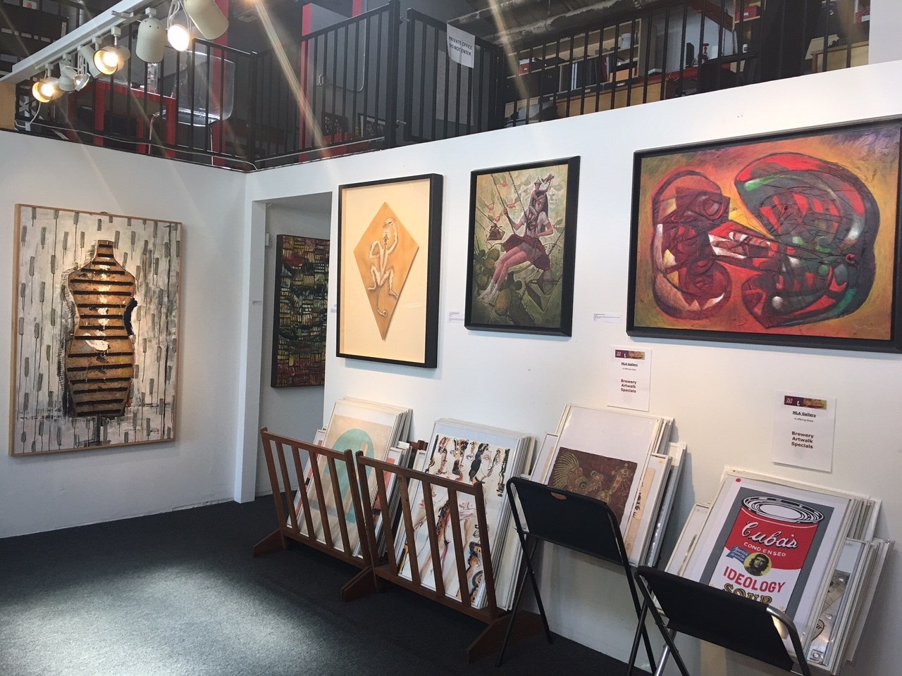 A paper cut out of a lizard on a piece of paper.