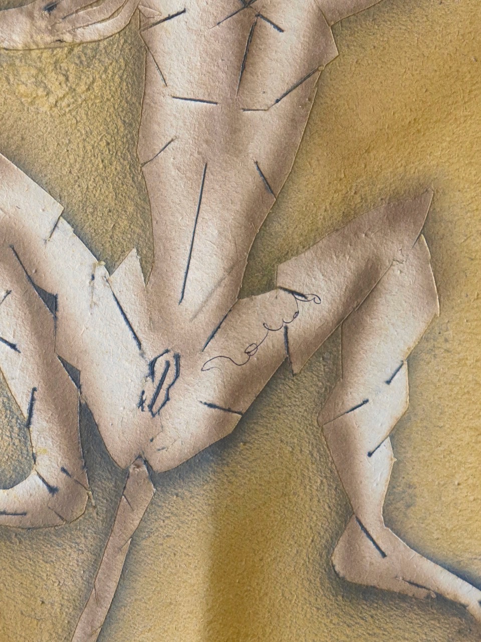 A paper cut out of a lizard on a piece of paper.