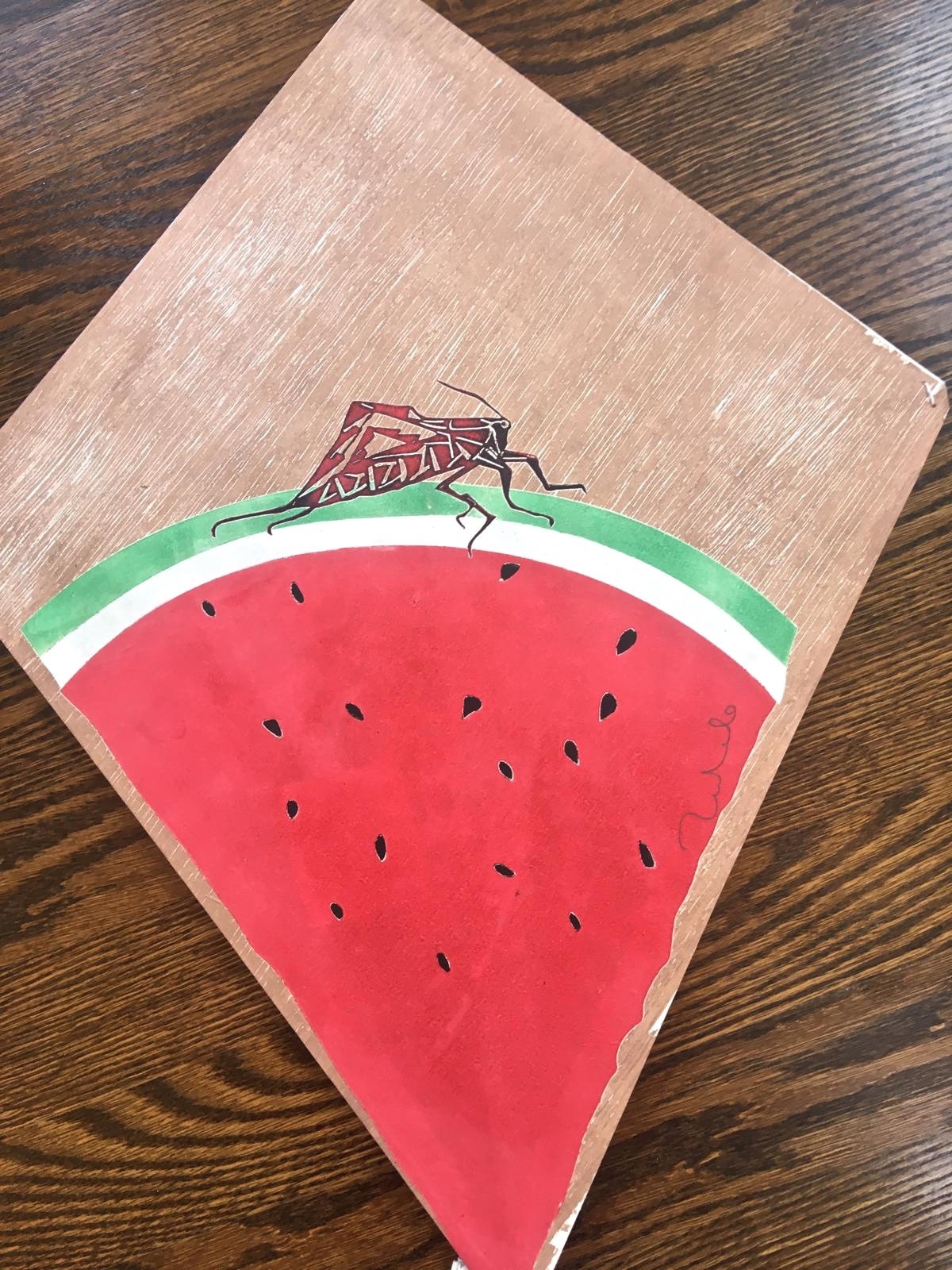 A piece of paper with a drawing of a bug on it.