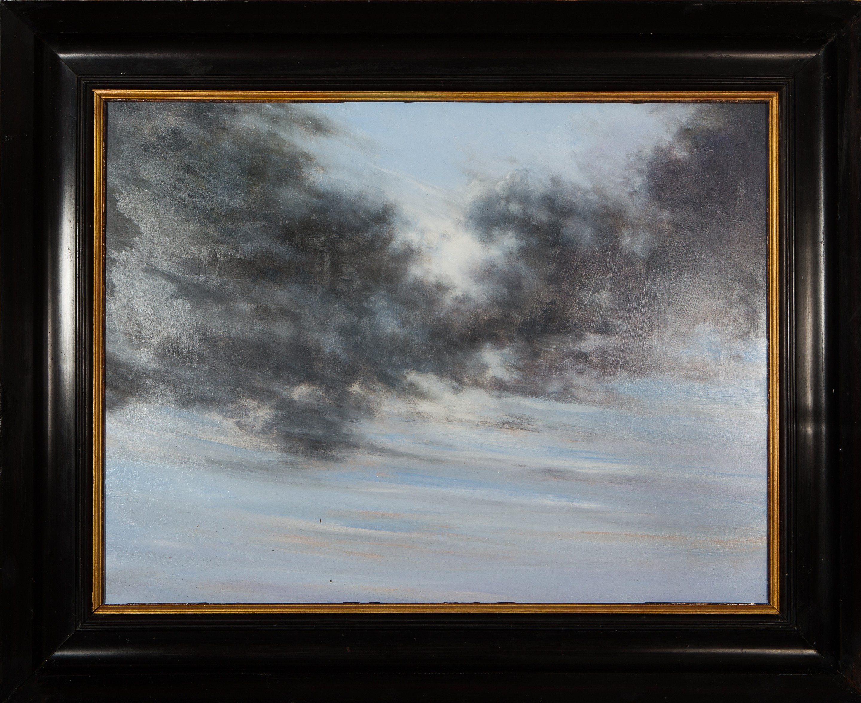 A painting of a cloudy sky in a black frame.