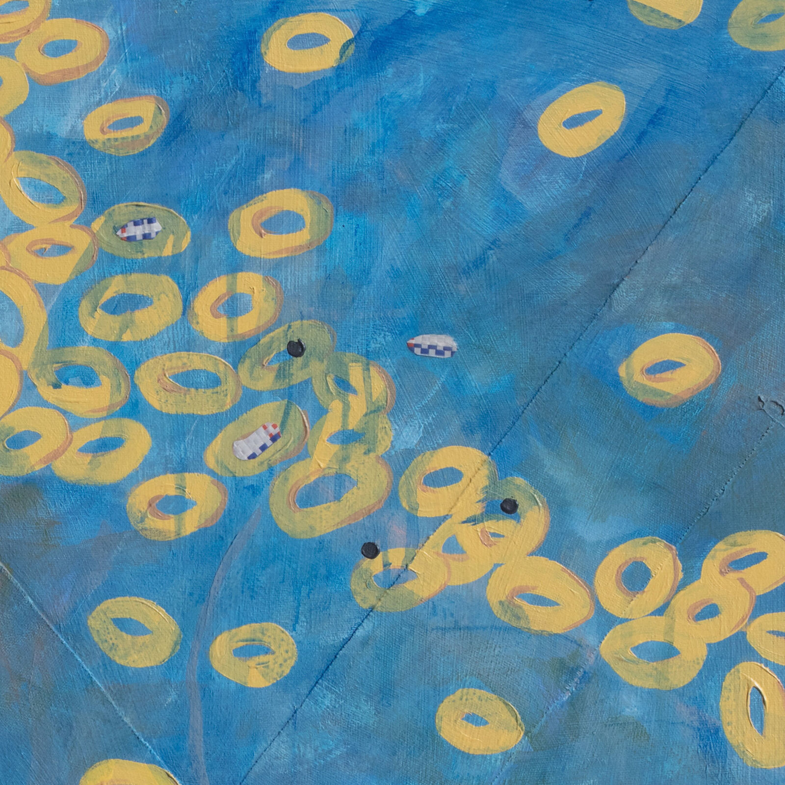 A painting of yellow circles on a blue background.
