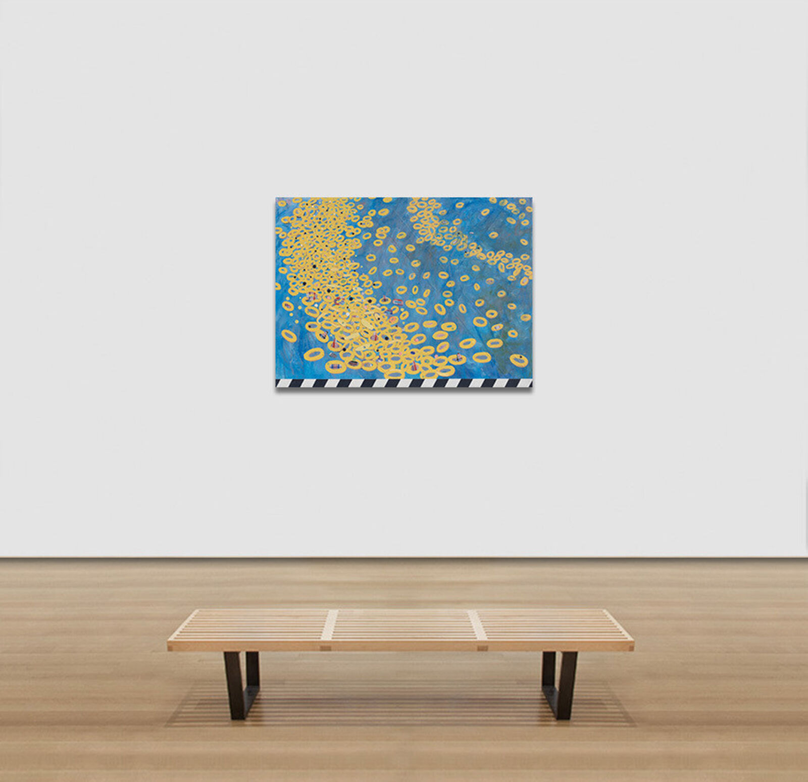 A painting of yellow circles on a blue background.
