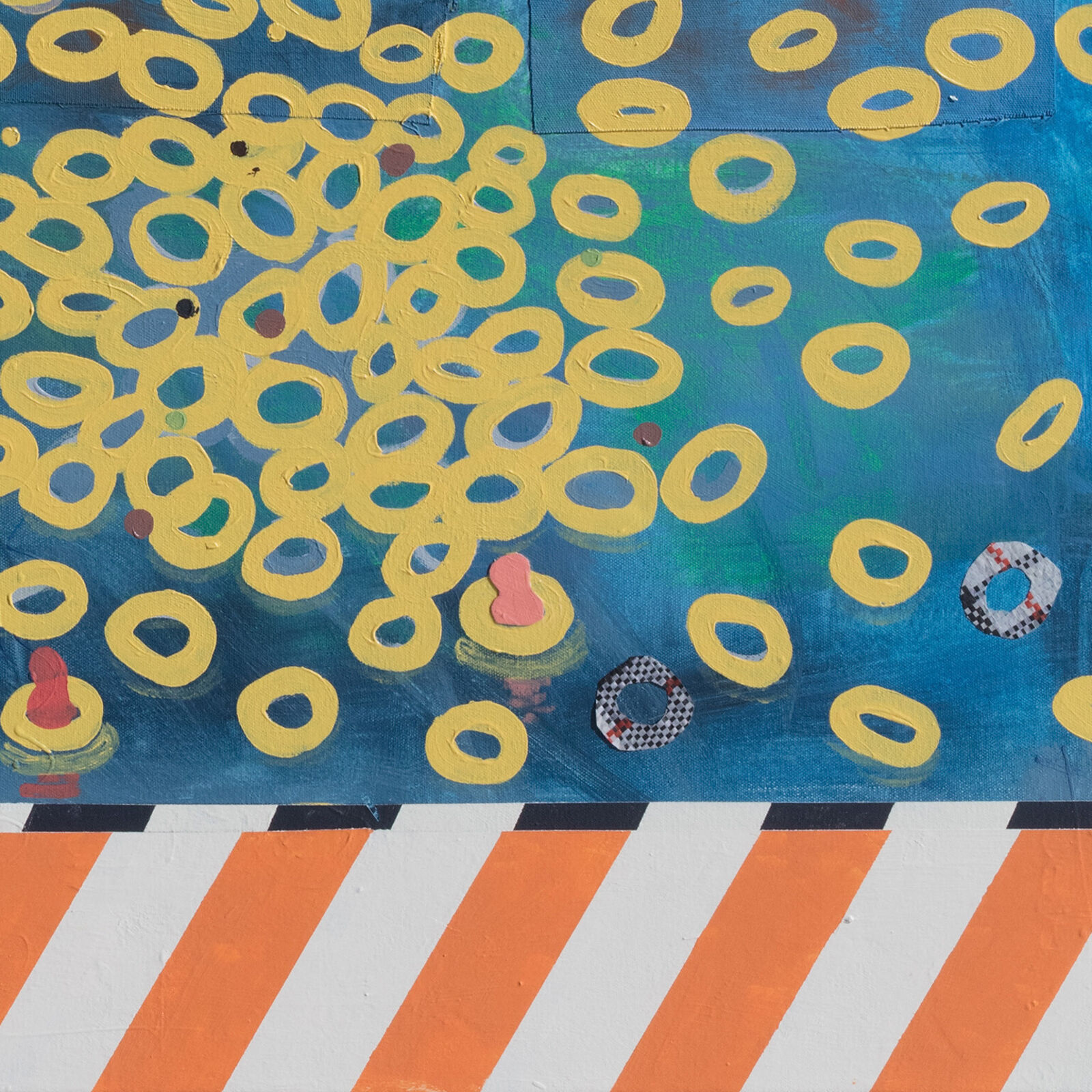 A painting on a wall with a blue background and yellow circles.