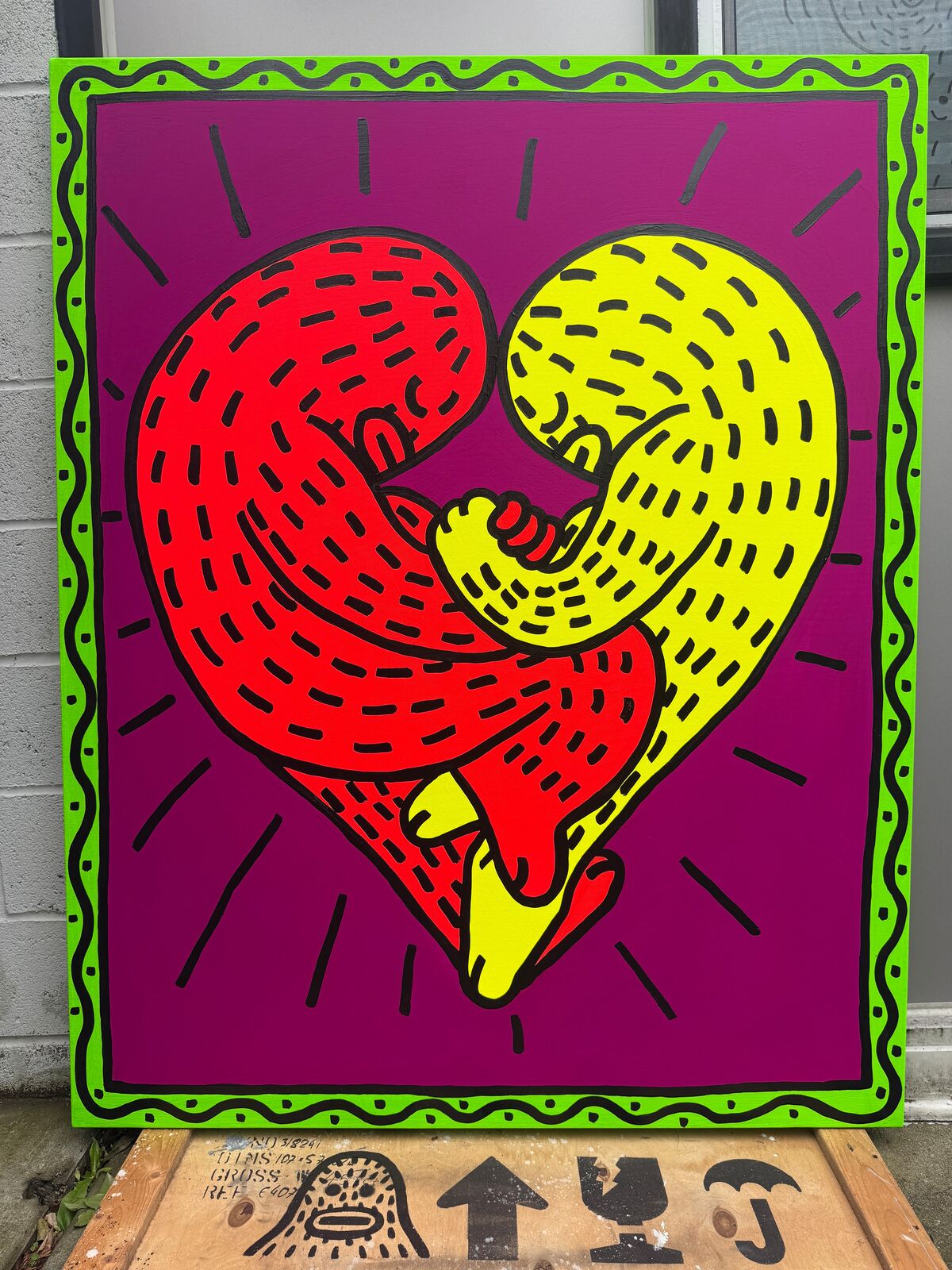 A painting of a red and yellow heart on a purple background.