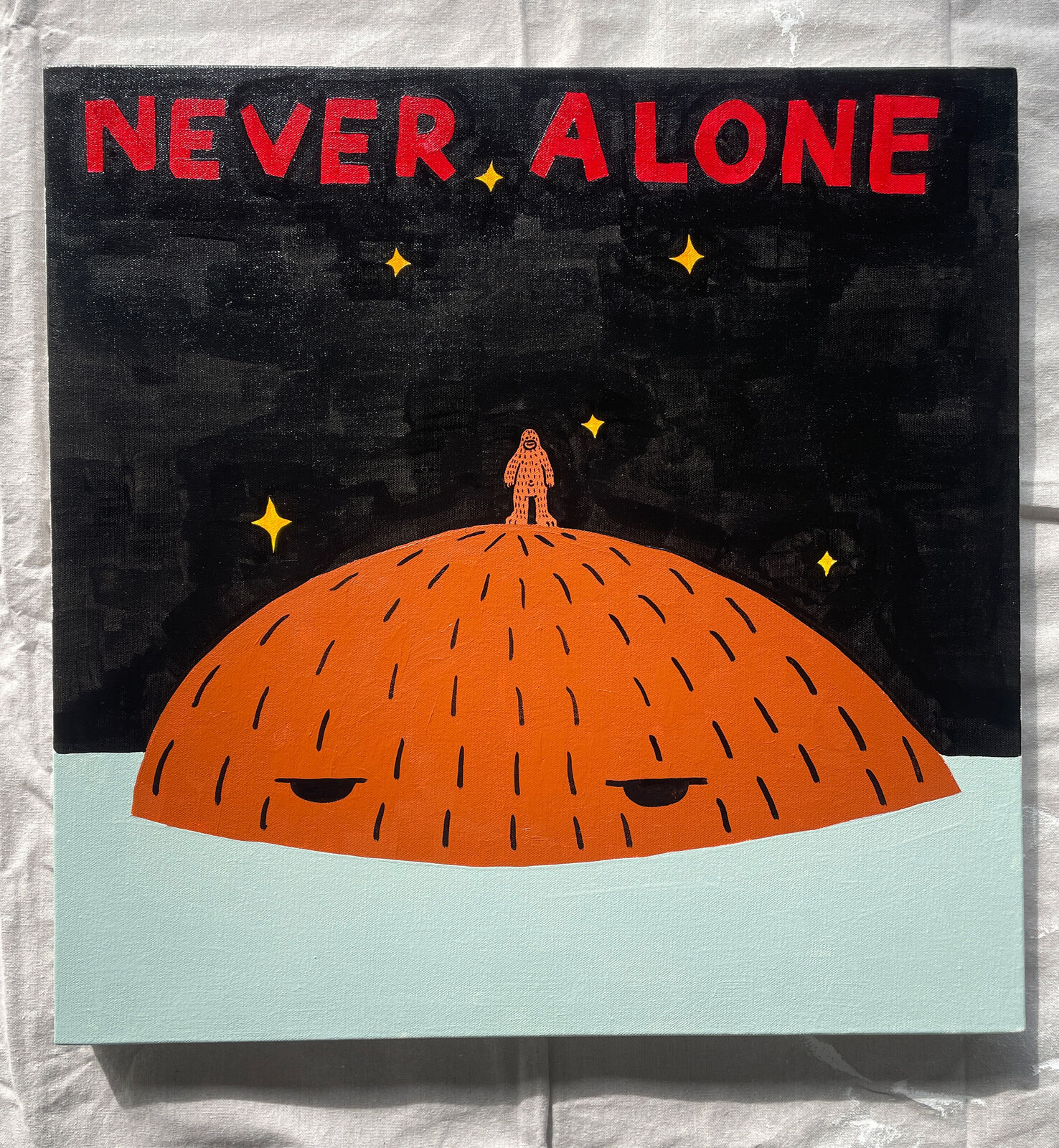A poster with a man standing on top of a planet.