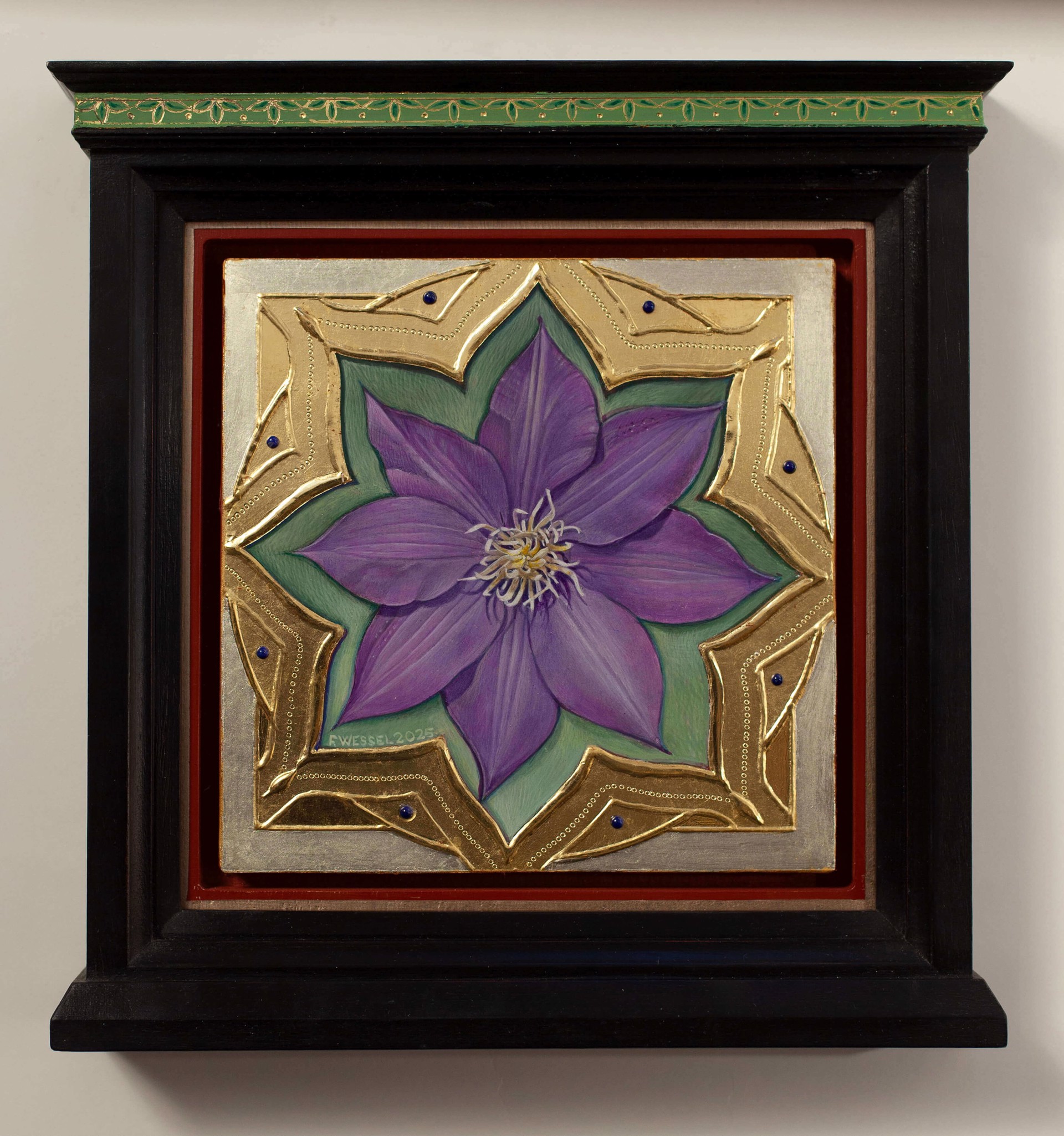A purple flower set within an ornate gold frame on a red background.