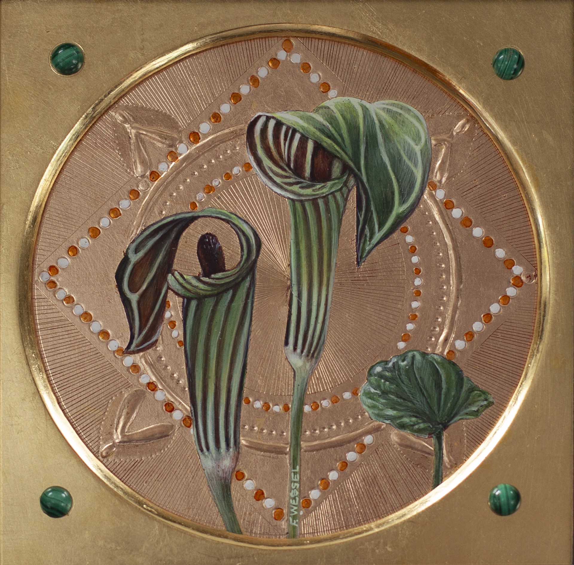 A picture of two flowers on a gold plate.
