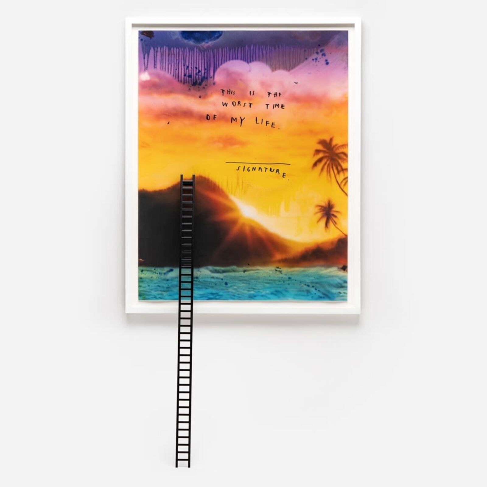 A picture of a ladder leading to a beach with a sunset in the background.