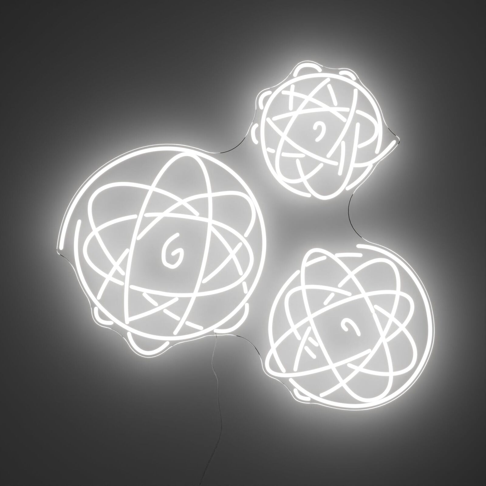 A white neon sign with three spheres on a black background.