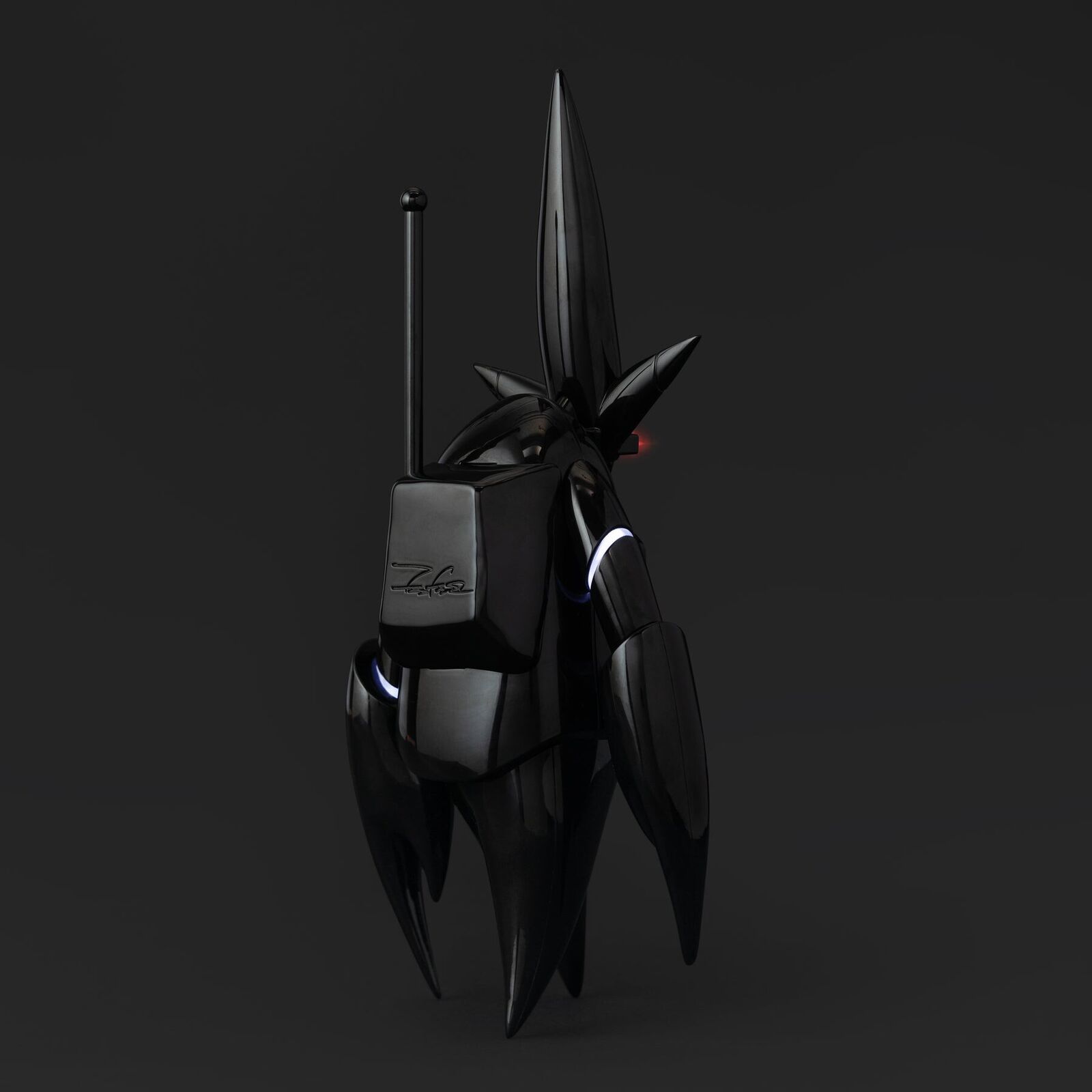 A black and red robot with a red light on it's head.