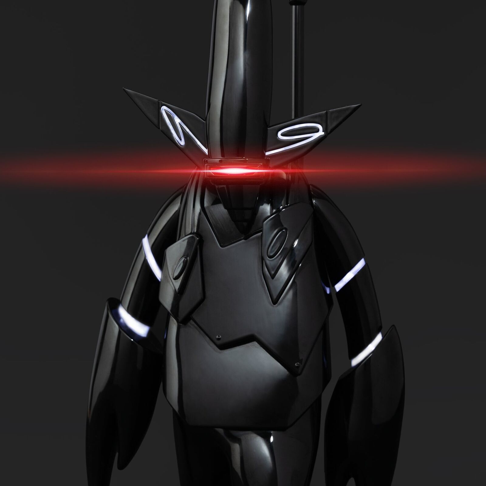 A black and red robot with a red light on it's head.