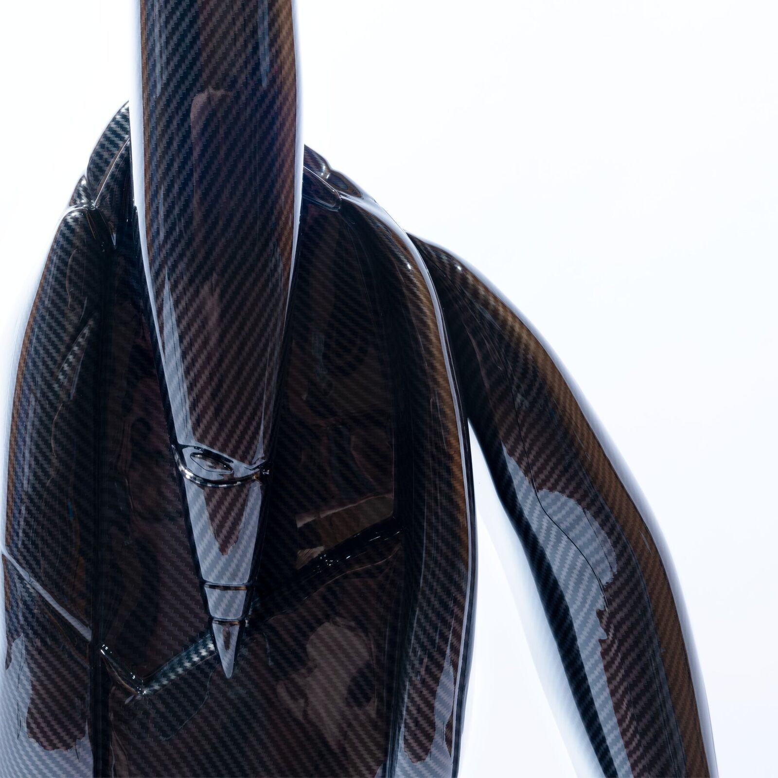 A 3D rendering of a black robot with a long tail.