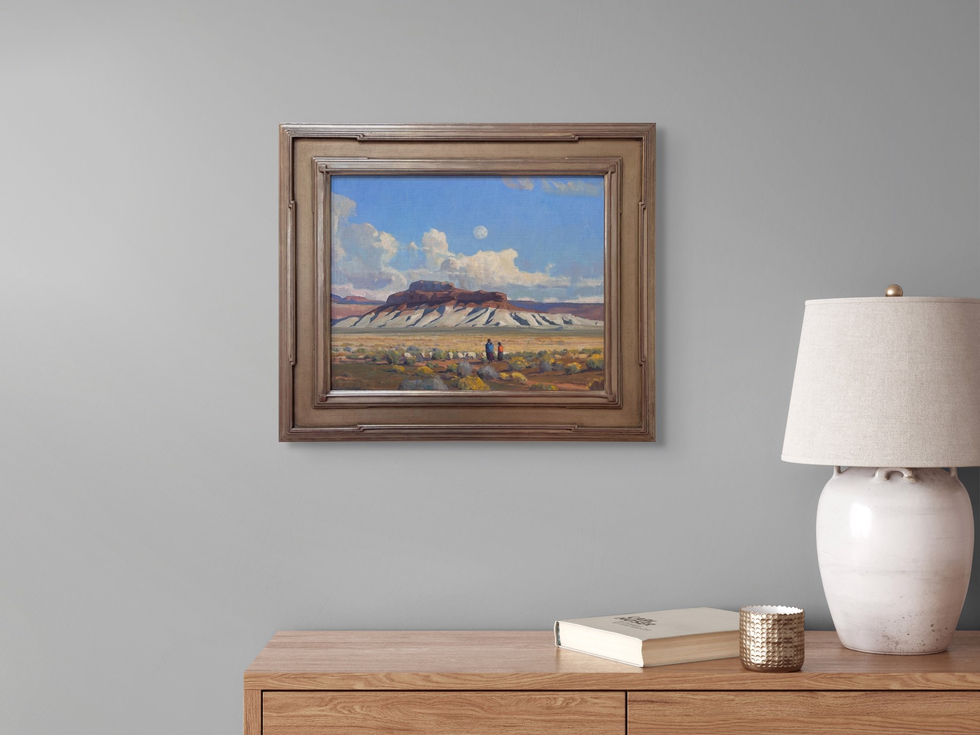 A painting of two people walking in the desert with a full moon in the sky.