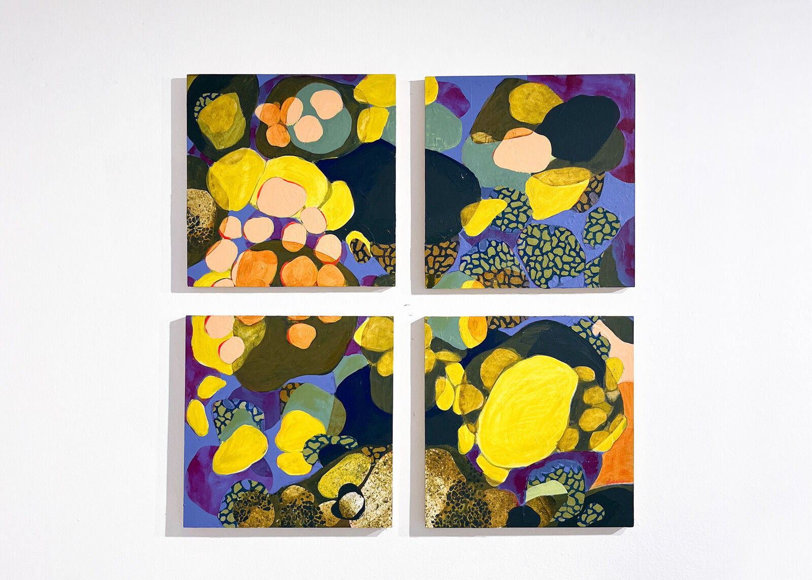 A vibrant four-panel abstract composition featuring organic shapes and bold colors.