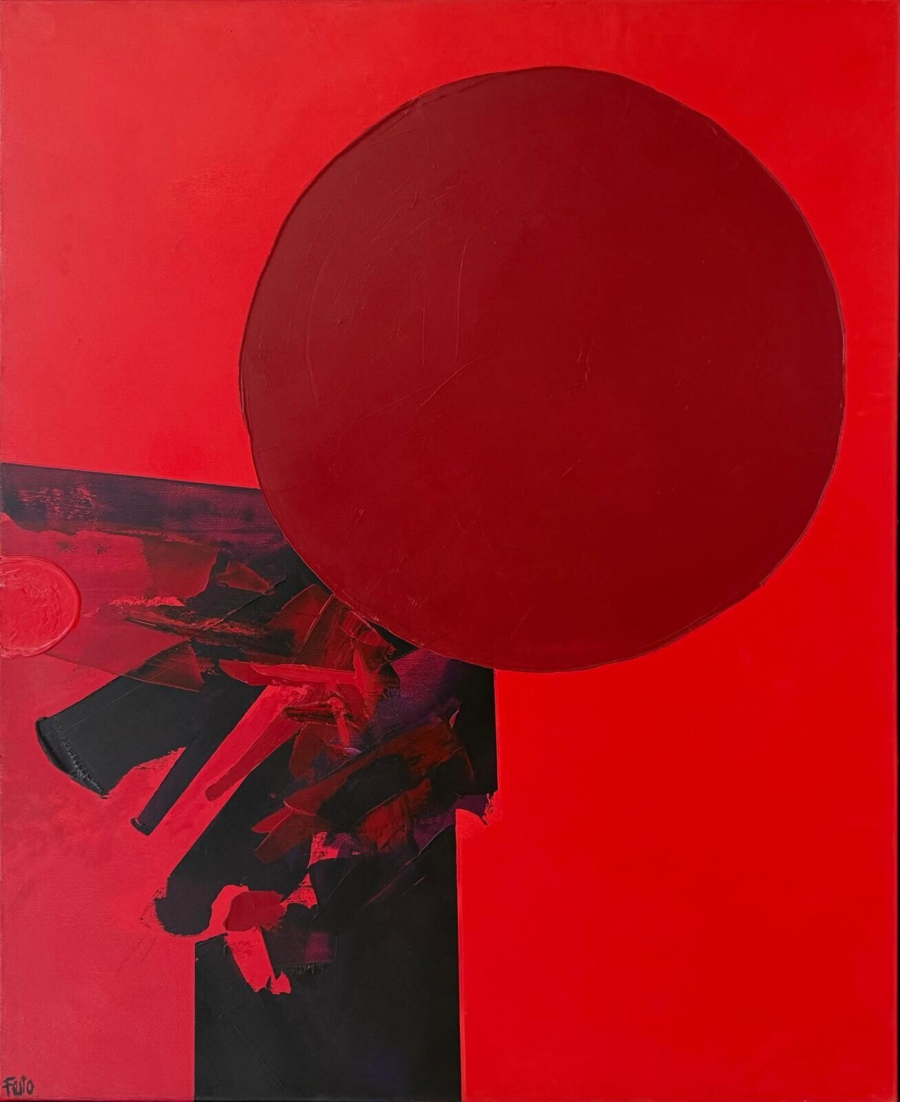 A bold abstract composition featuring a large red circle against a vibrant red background with dark, fragmented shapes below.