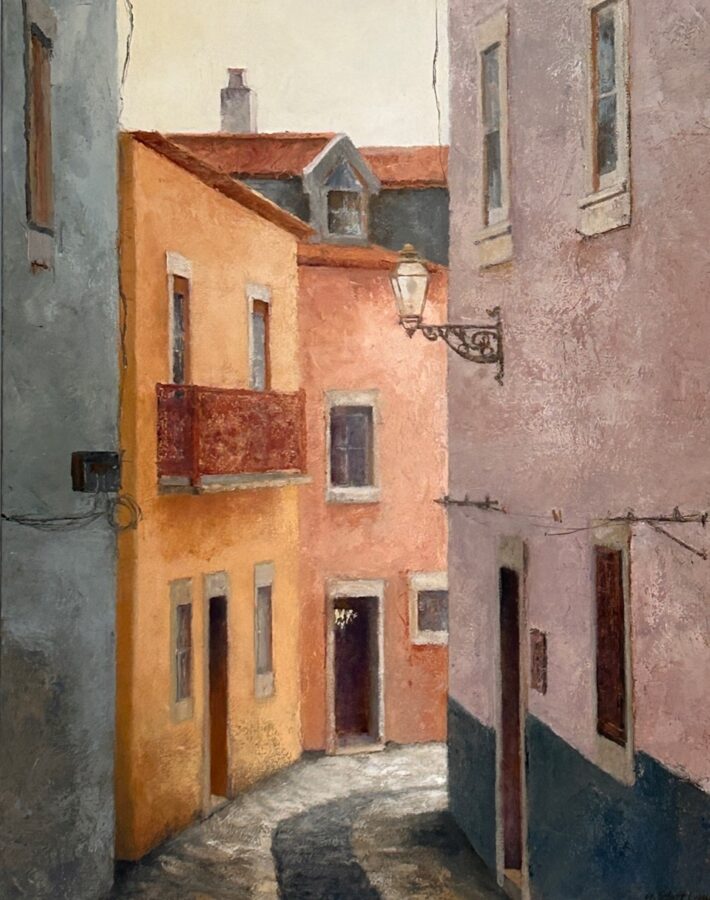 A sunlit European alleyway with textured pastel buildings and a hanging lantern.