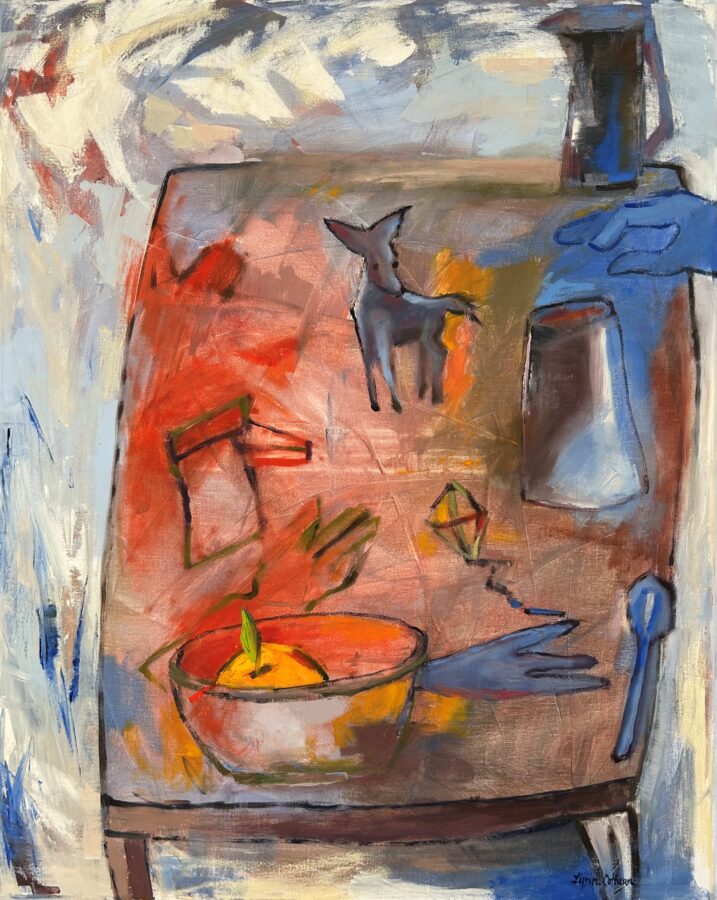 A vibrant still life on a wooden table featuring a bowl of fruit, a small dog figurine, and various glassware.