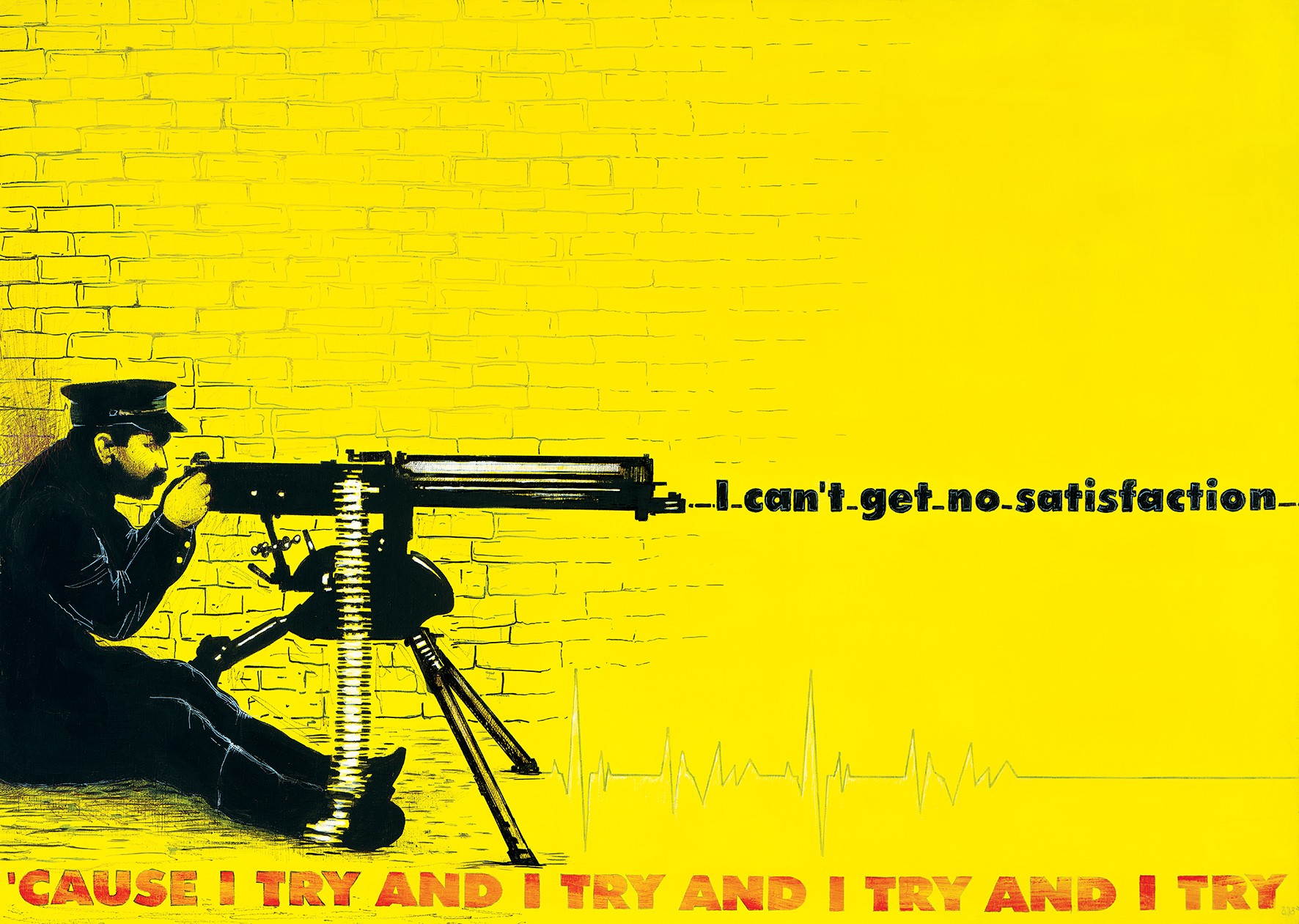 A man sitting on the ground next to a machine gun.