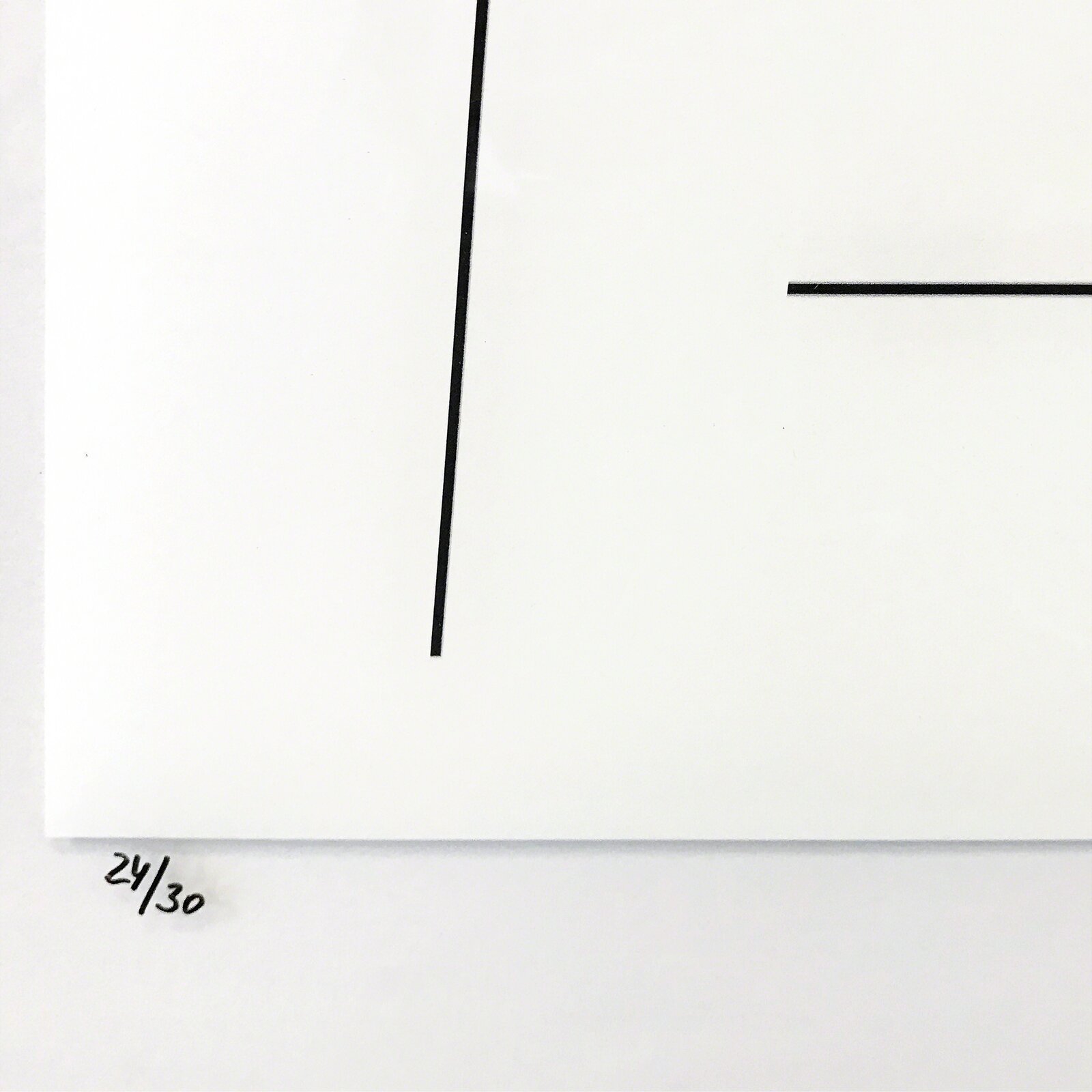 A minimalist composition featuring two solid colored squares framed by thin black lines.