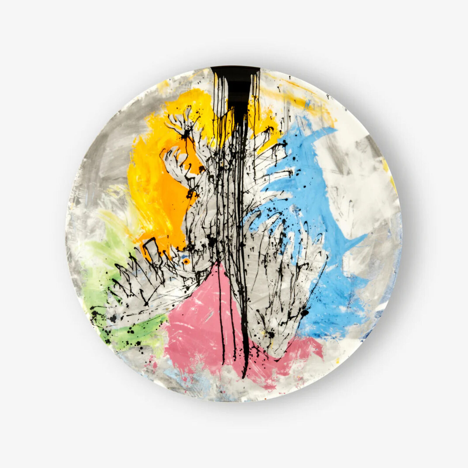 A plate with a painting on it on a white surface.