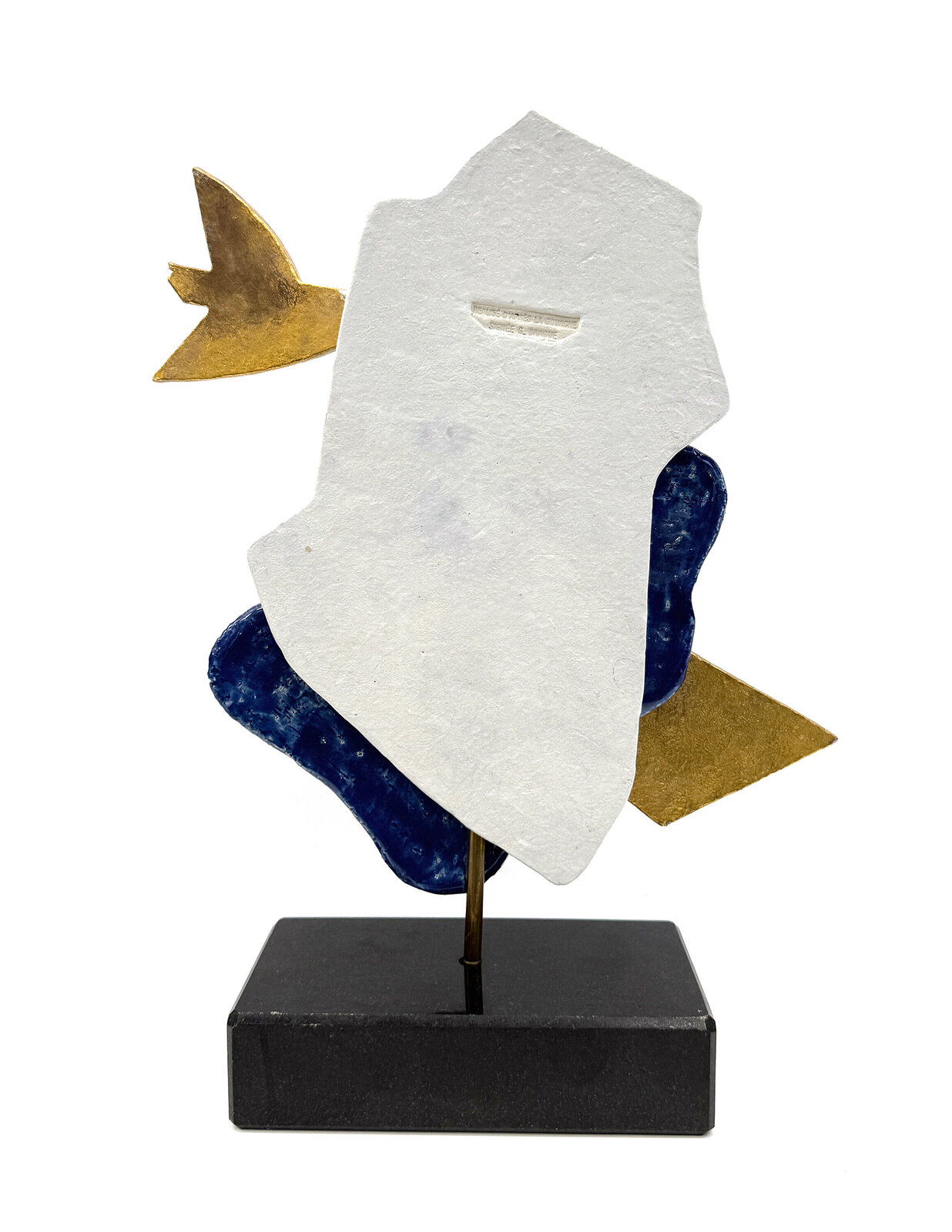A sculptural composition featuring two stylized golden fish against a layered blue and white stone base.