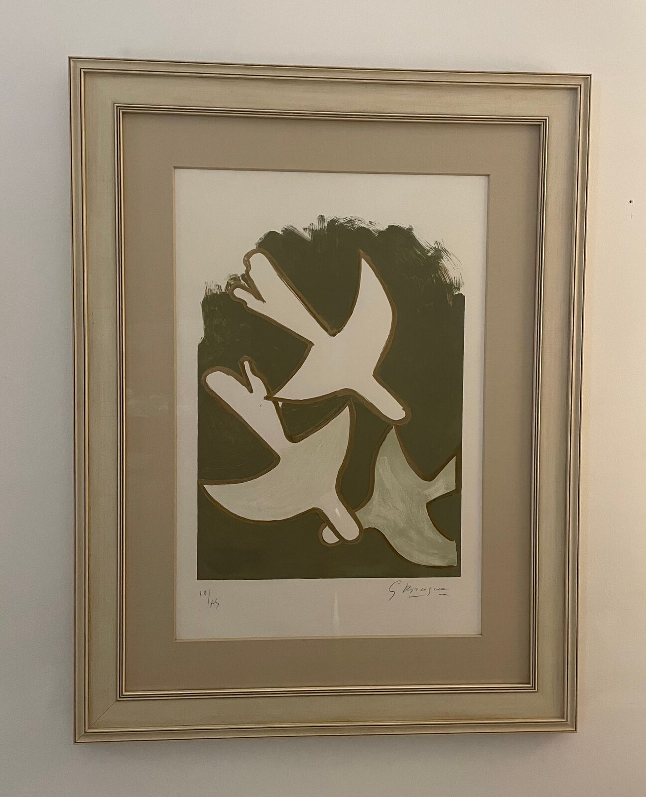 A painting of two white doves flying in the air.