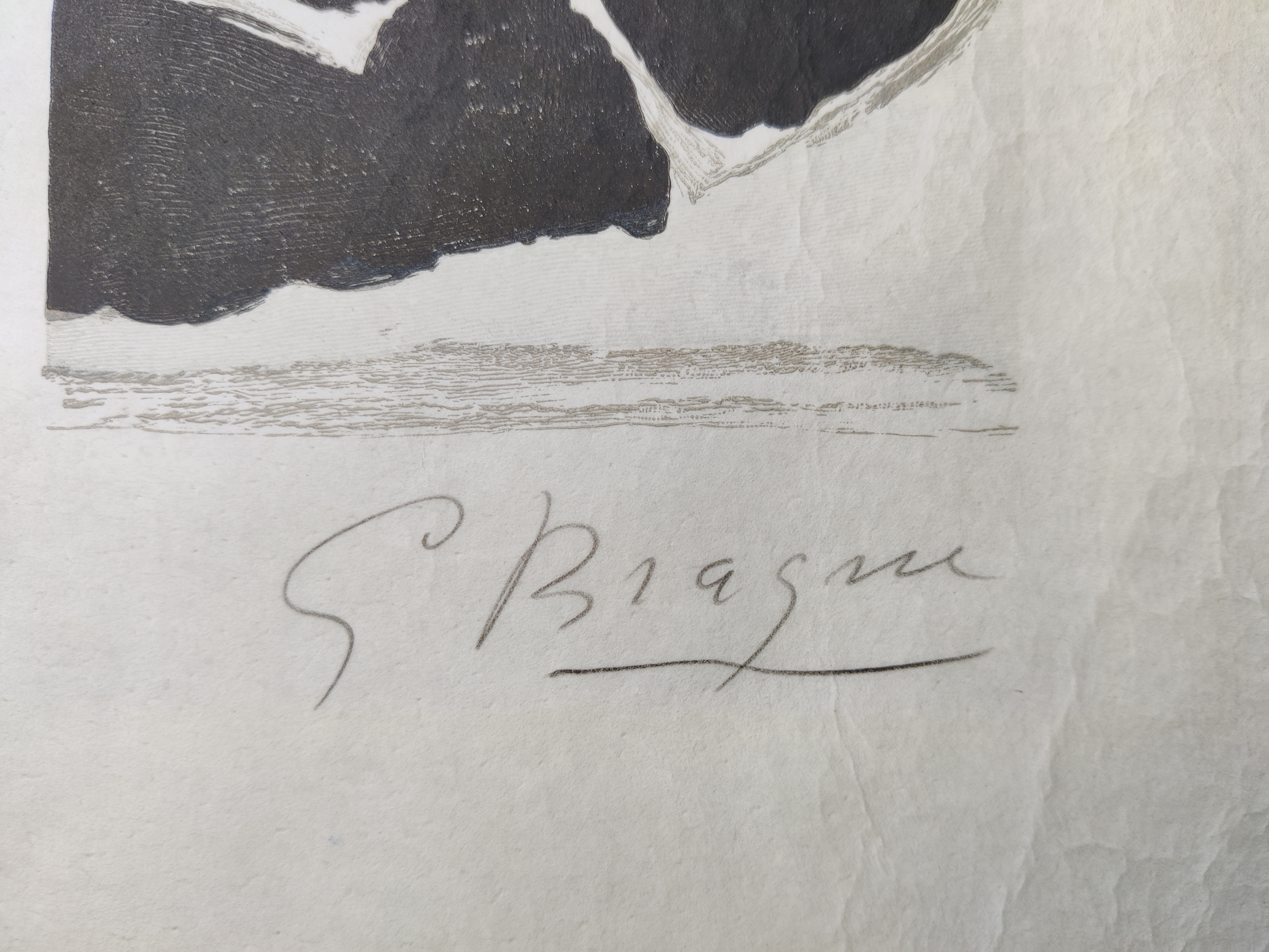 A blue and black print on a piece of paper.
