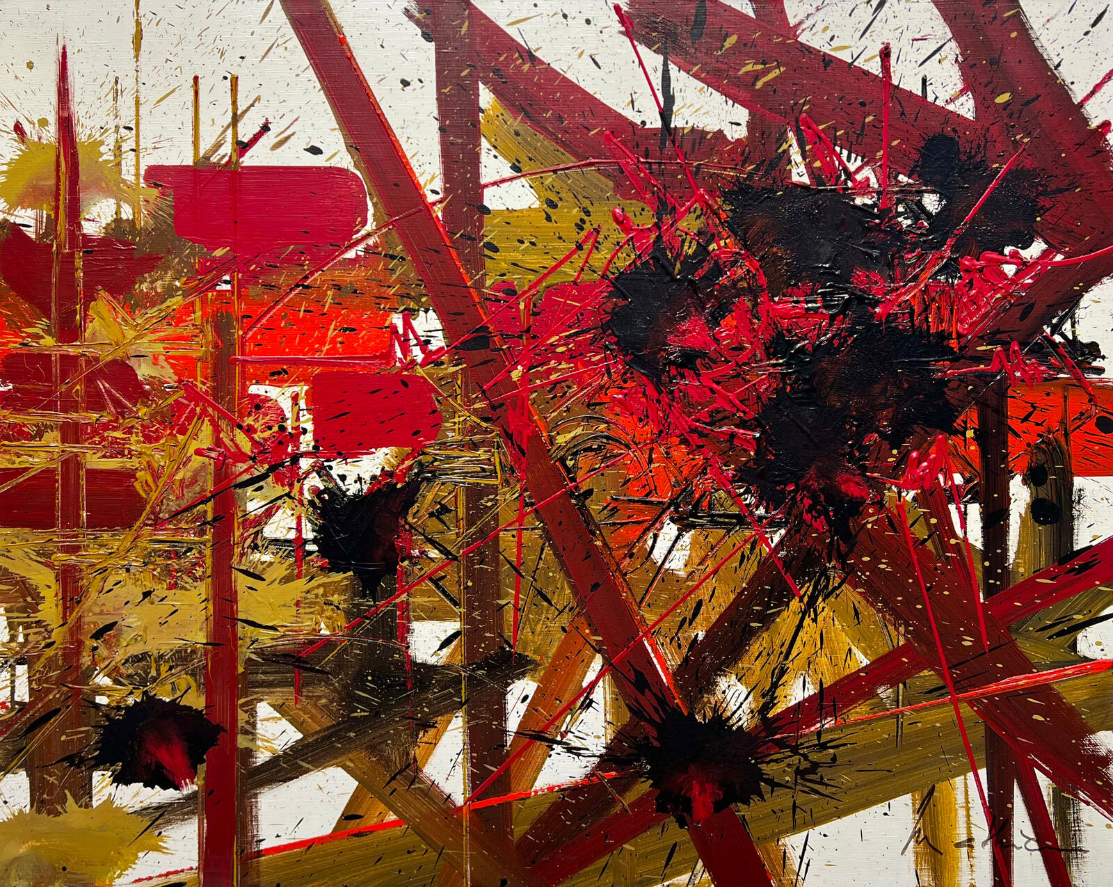 A painting with red, yellow and black paint splatters on it.
