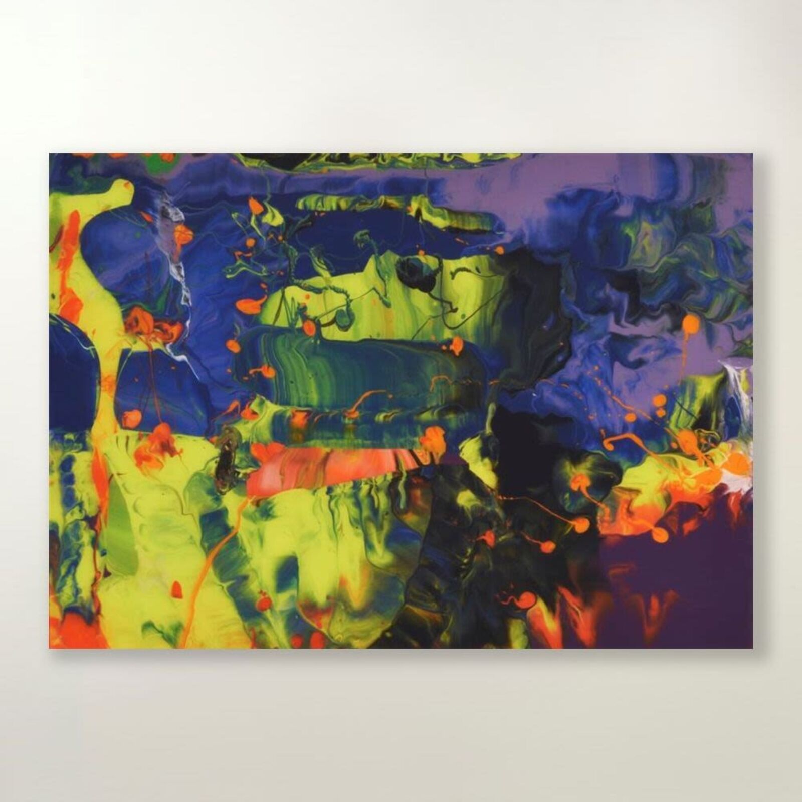A colorful abstract painting on a white wall.