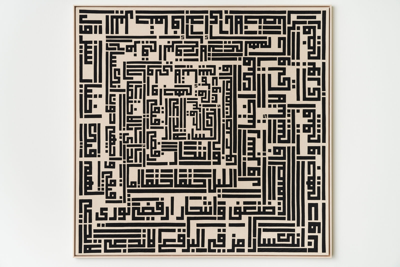 A black and white maze on a white wall.